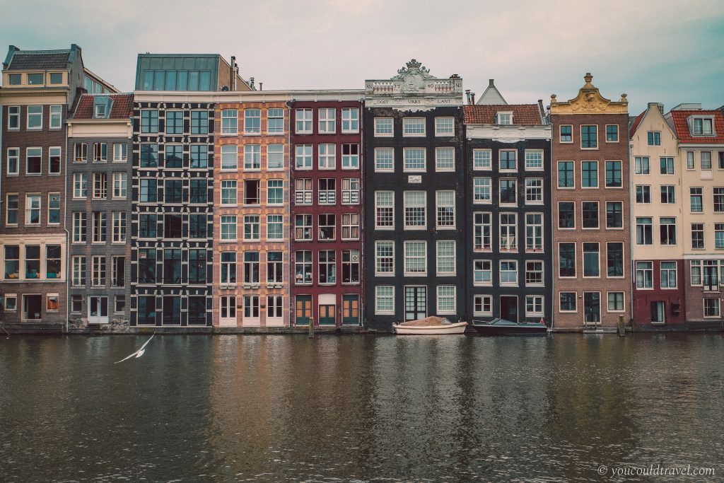 Damrak canal houses in Amsterdam