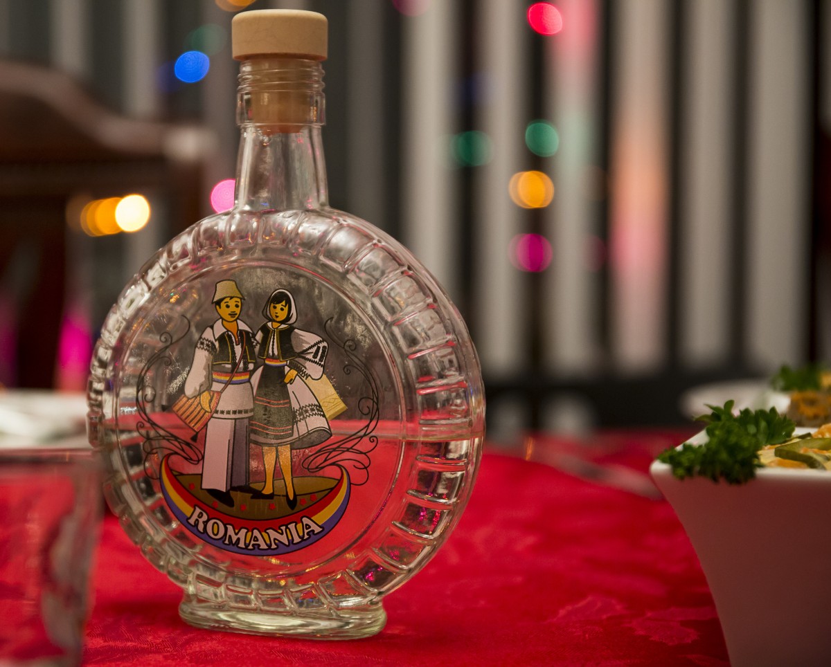 Authentic bottle of tuica with Romanian motifs on it Authentic bottle of tuica with Romanian motifs on it