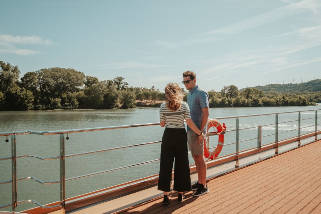 Cory and Greg from You Could Travel enjoying their Avalon Waterways Cruise on the deck of the ship