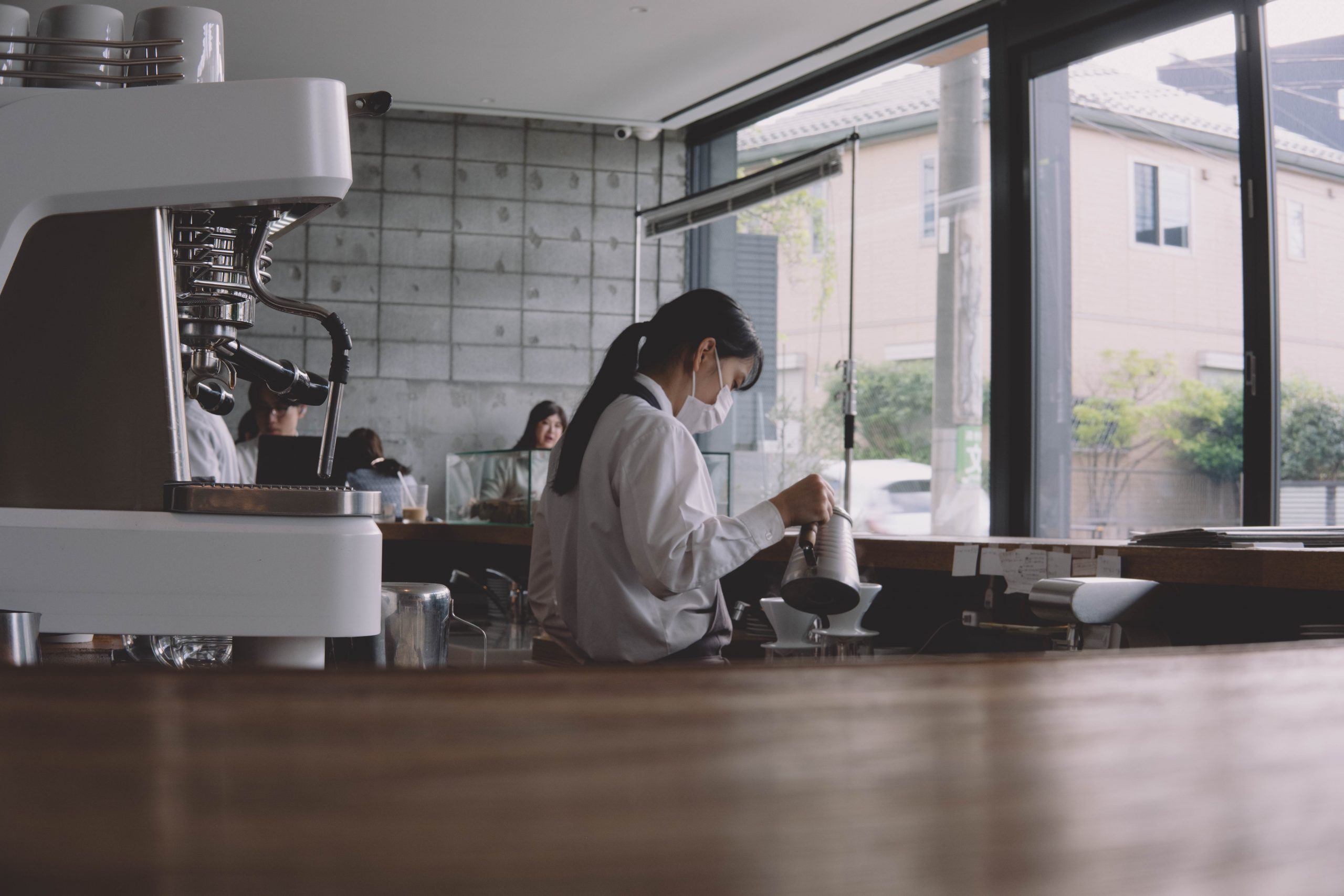 Barista at work at Ogawa coffee lab in tokyo Barista at work at Ogawa coffee lab in tokyo