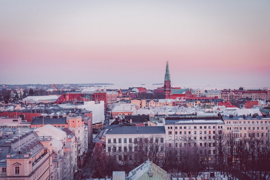 A bird's-eye perspective of Helsinki showcasing its rooftops and icy shores