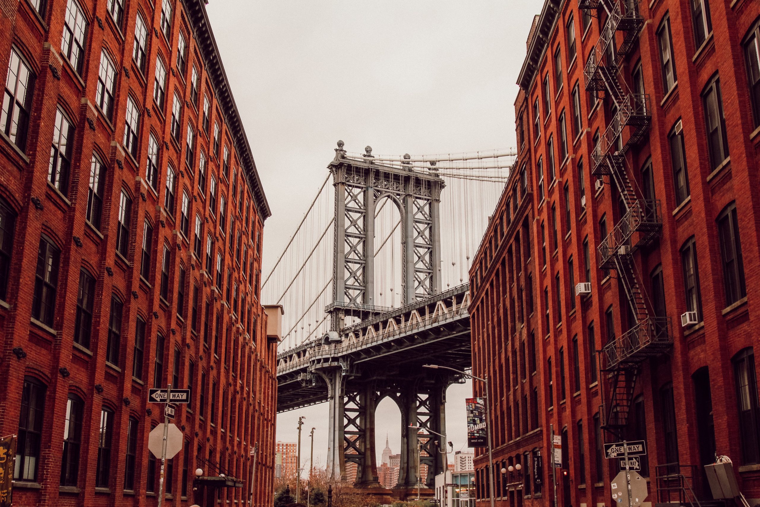 Brooklyn bridge inbetween two brick buildings Brooklyn bridge inbetween two brick buildings