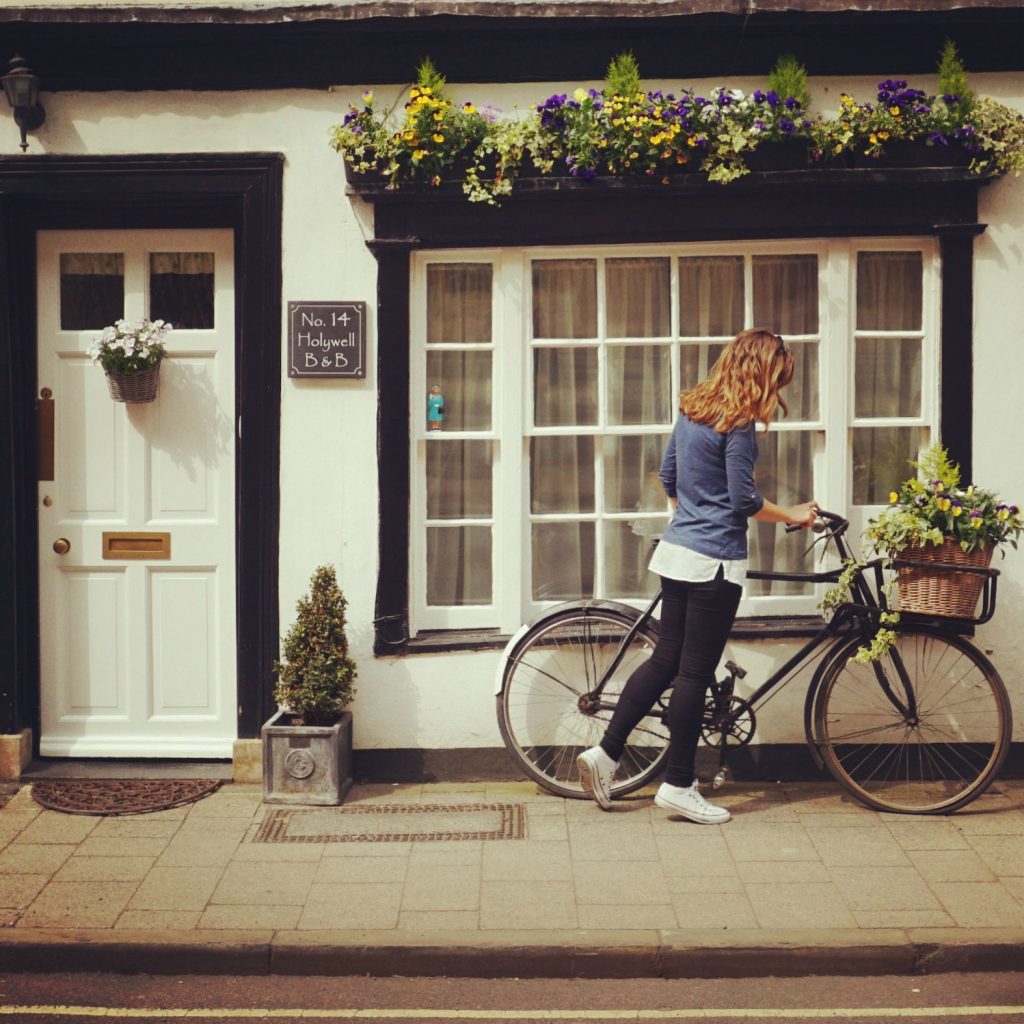 Cory riding a cute girly bike in Oxford, England