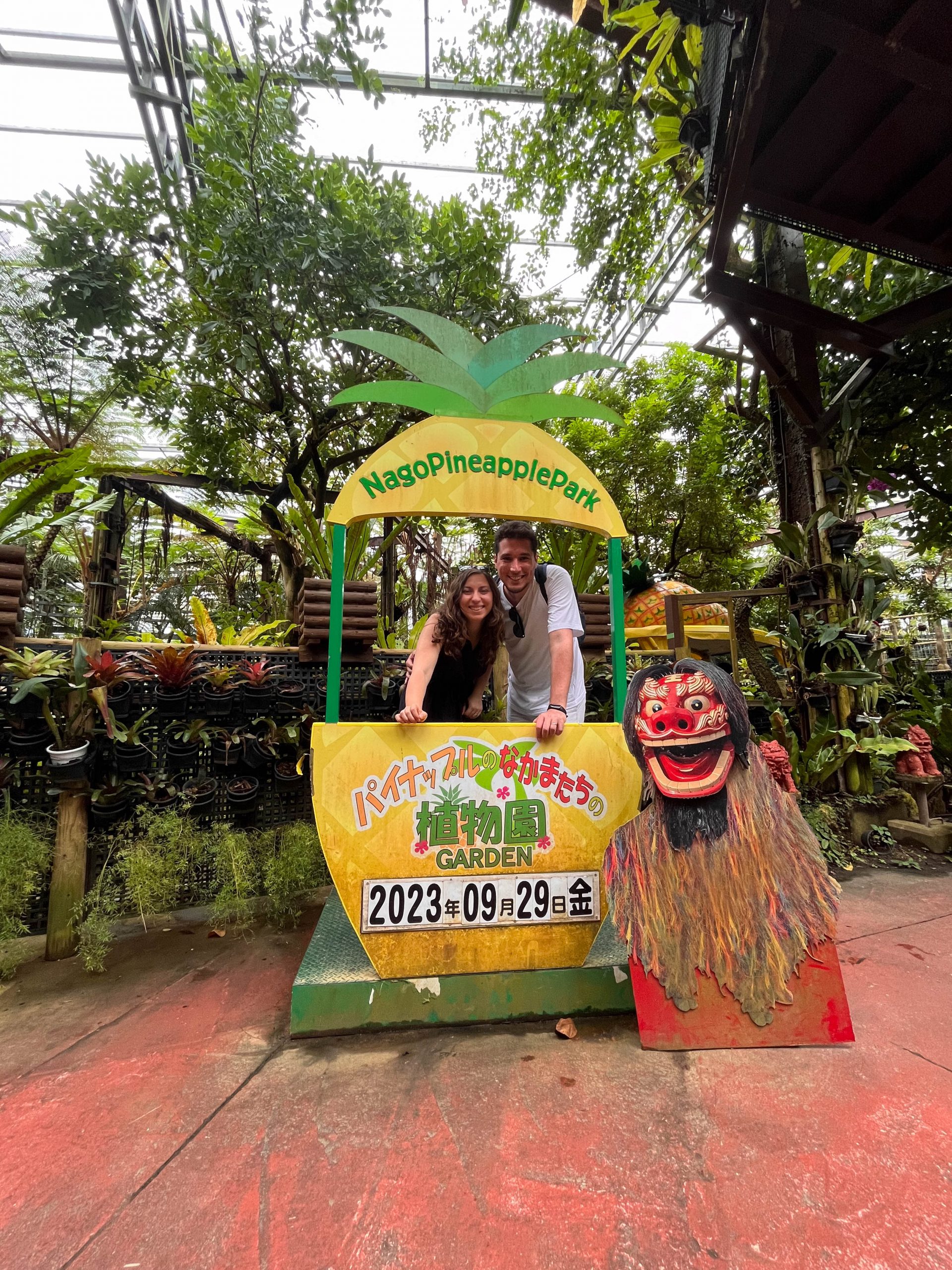 Cory and Greg taking cheesy photos at Nago Pineapple Park