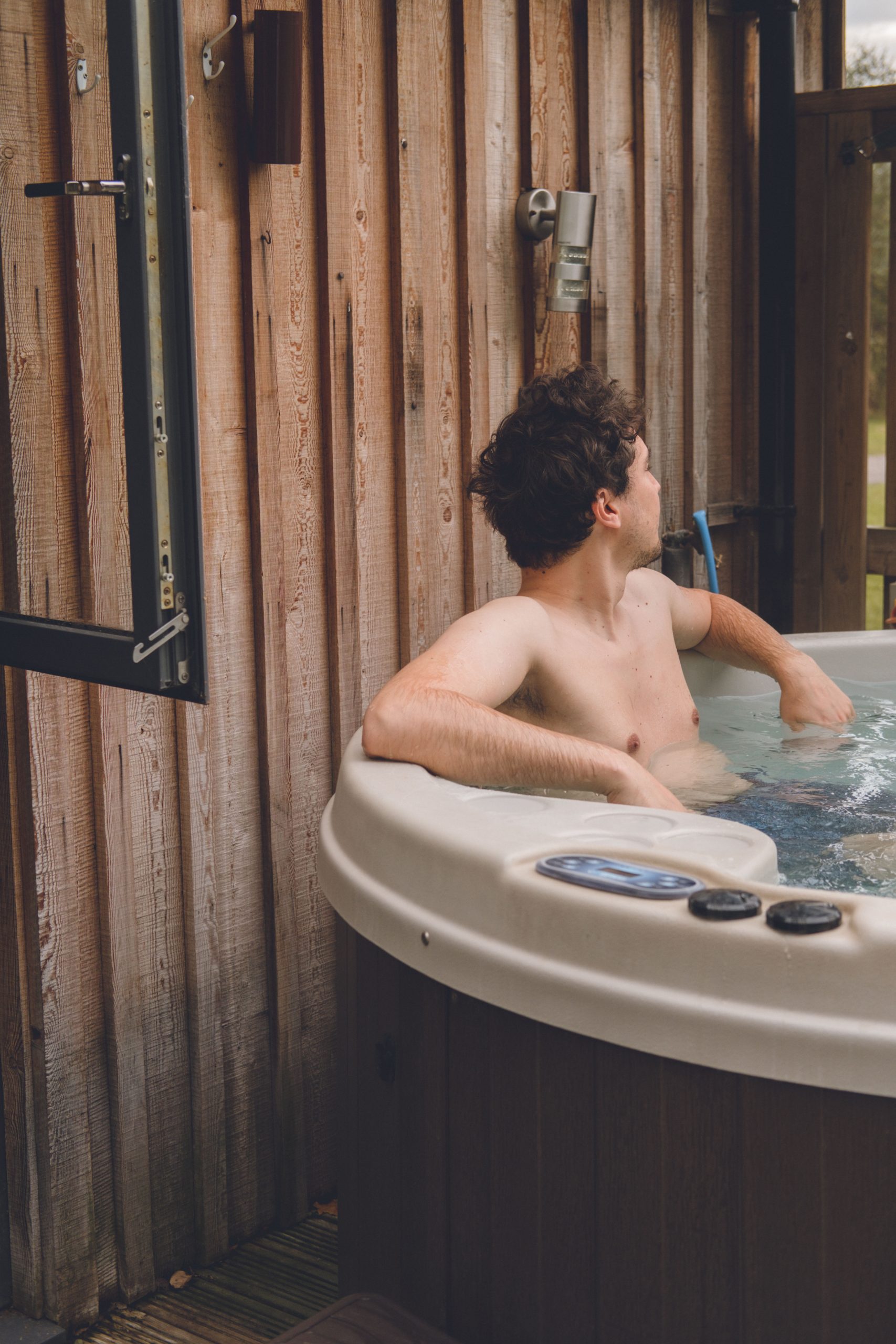 chilling in the hot tub at the sherwood hideaway