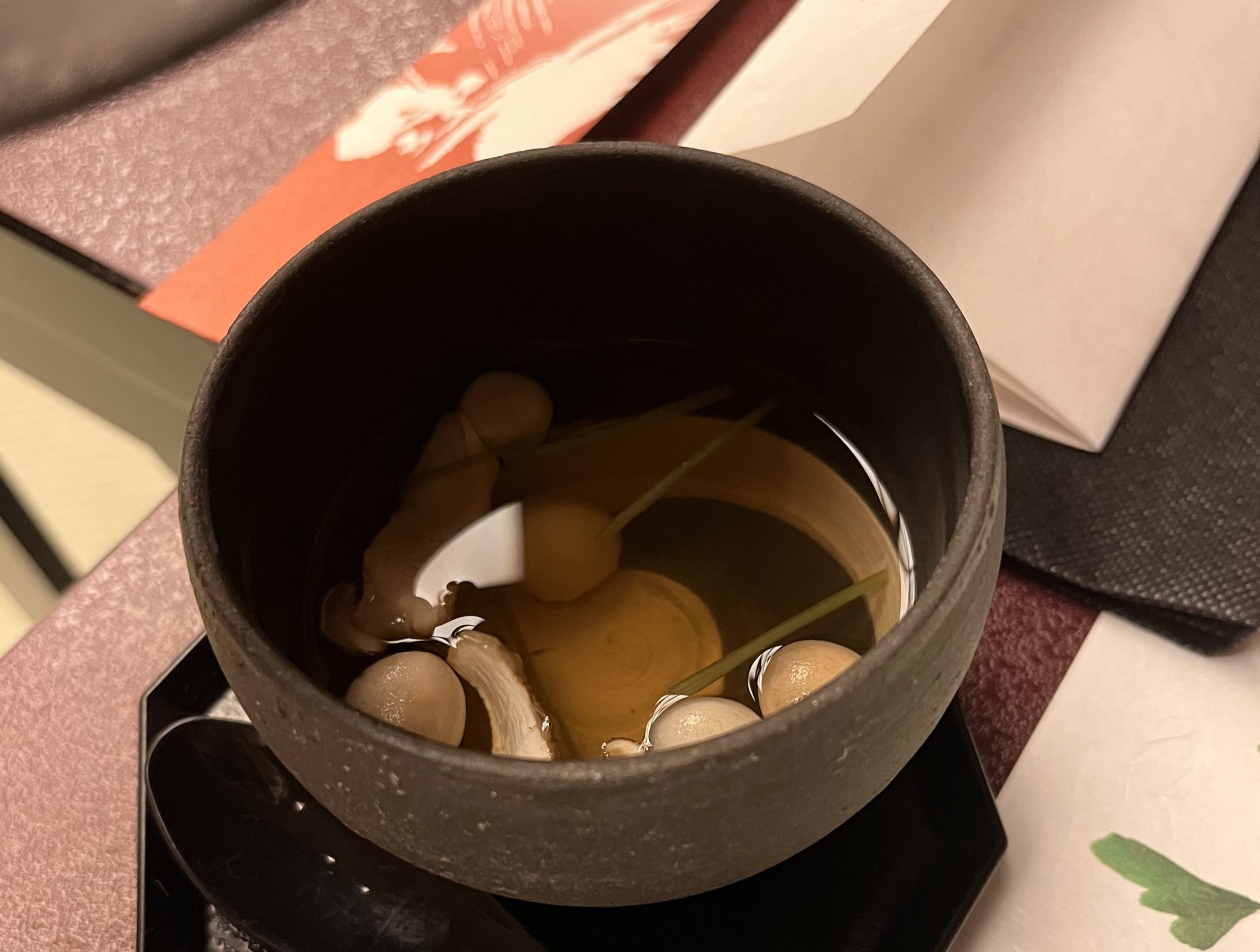 Clear miso with mushrooms and clams at Nishiyama onsen in Japan