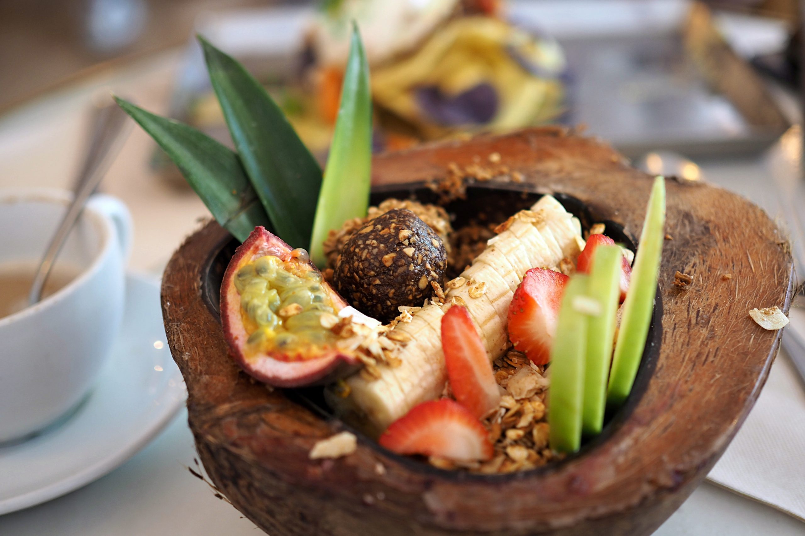 Coconut bowl filled with fresh fruits