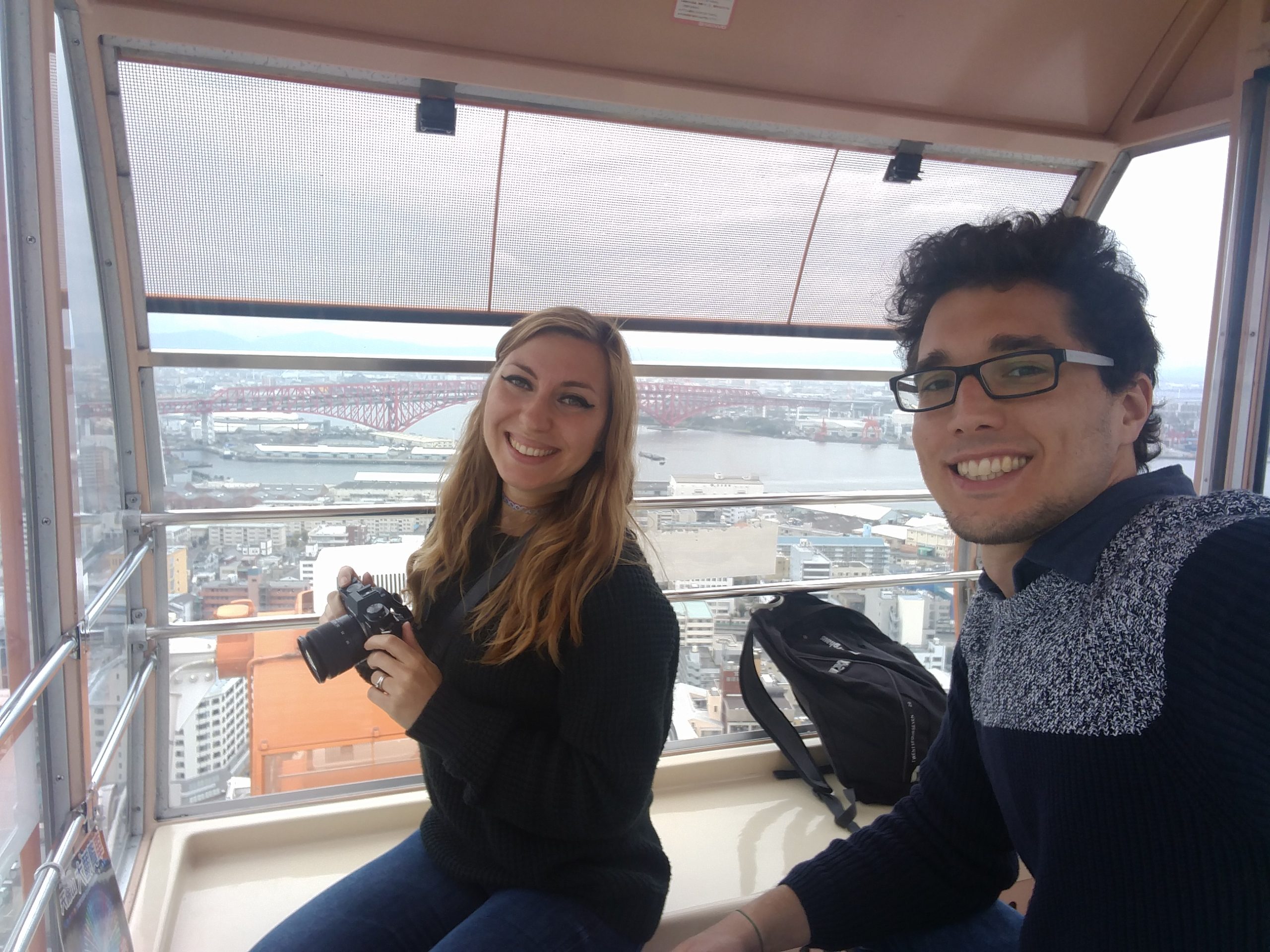 Cory and G taking pictures from the Ferris wheel in Osaka
