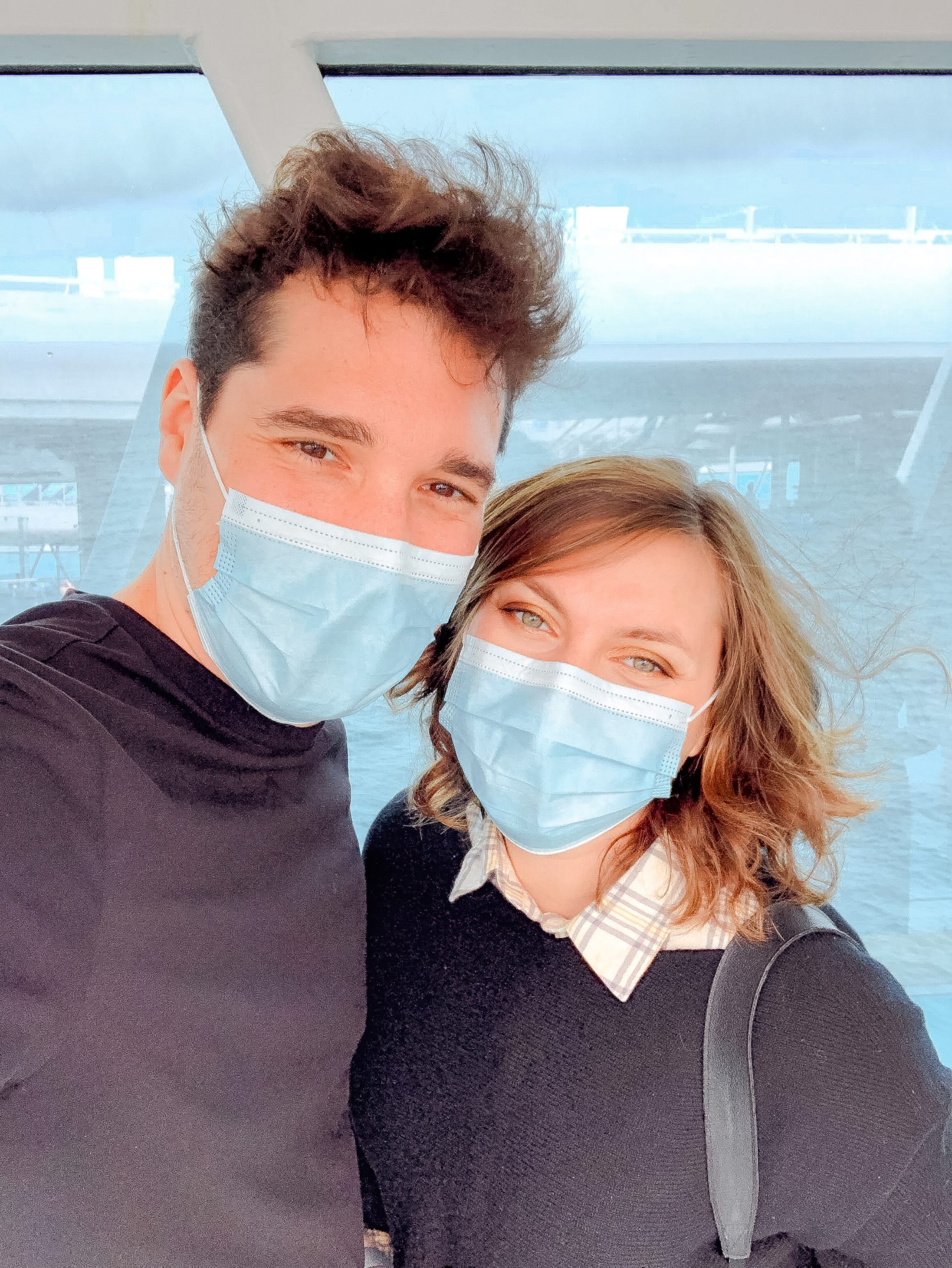 Cory and G from You Could Travel wearing face masks on Princess Cruise
