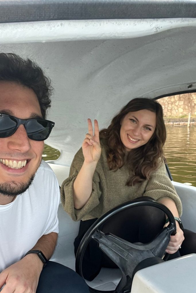 Cory and Greg from You Could Travel paddling inside the swan boat in Ueno Park