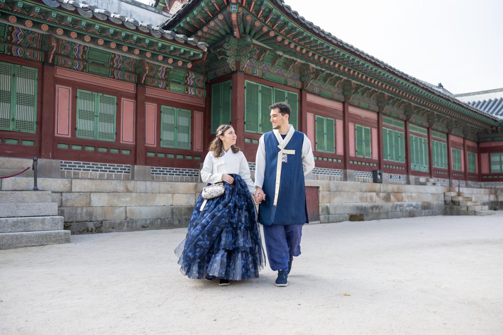 Cory and Greg from You Could Travel showing how to wear a traditional Hanbok in Seoul