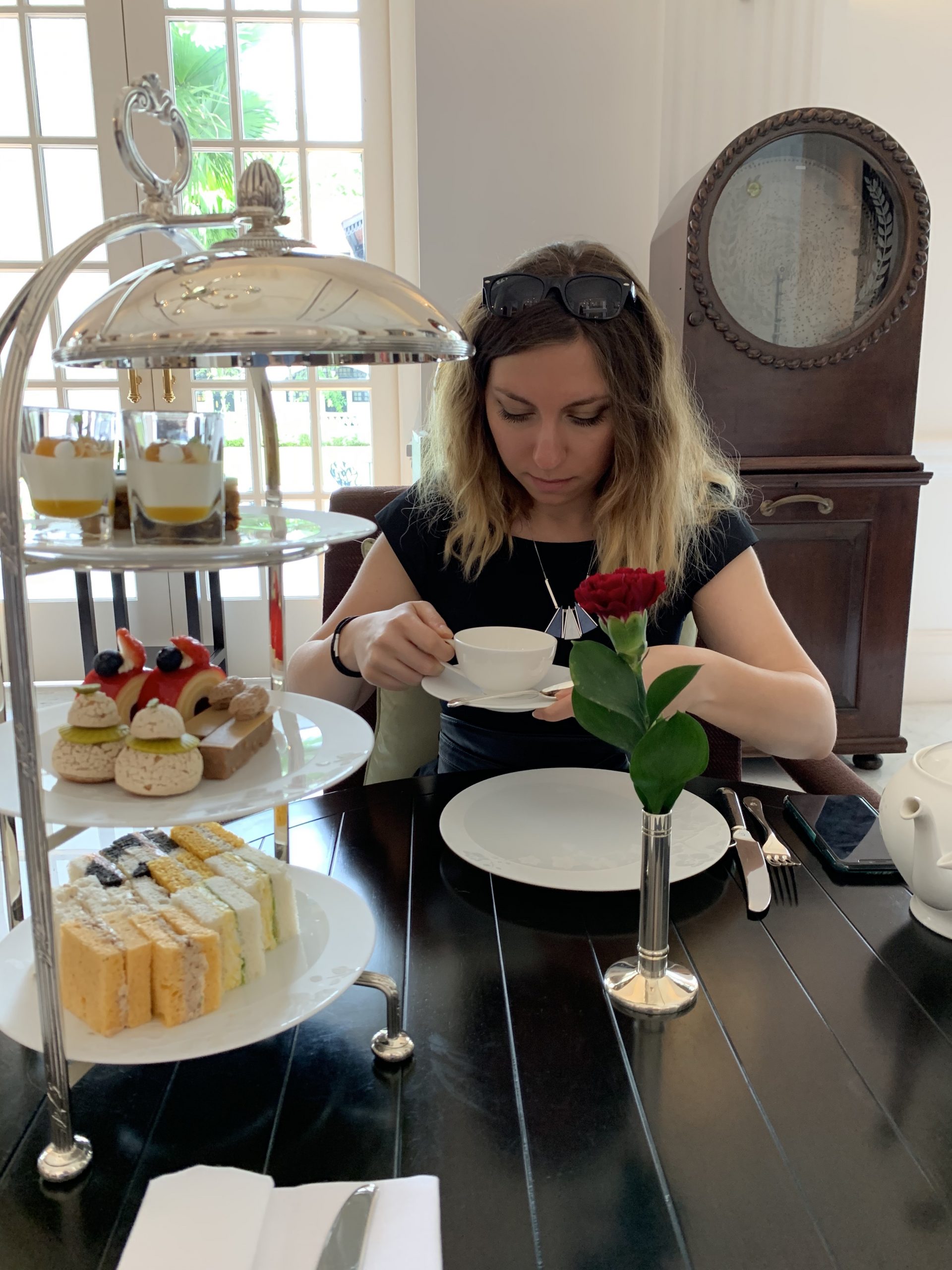 Cory enjoying her afternoon tea at Raffles Singapore Cory enjoying her afternoon tea at Raffles Singapore