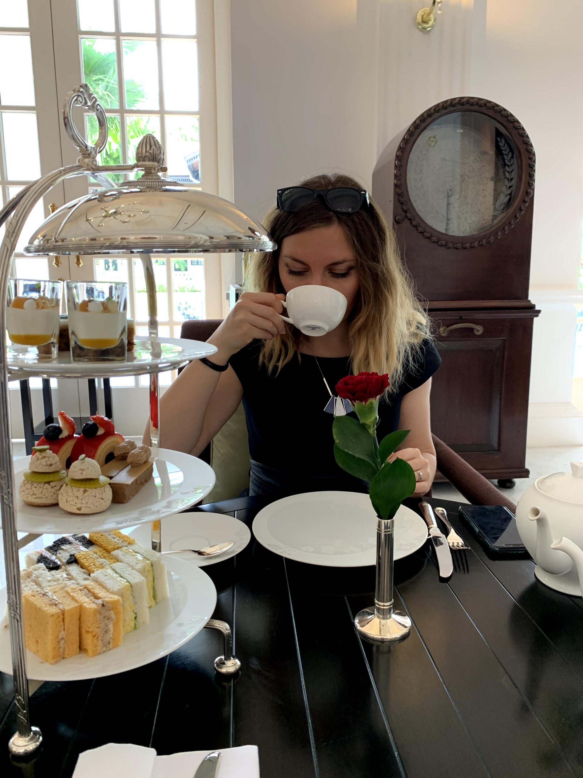 Cory enjoying her loose leaf tea at Raffles Singapore Cory enjoying her loose leaf tea at Raffles Singapore