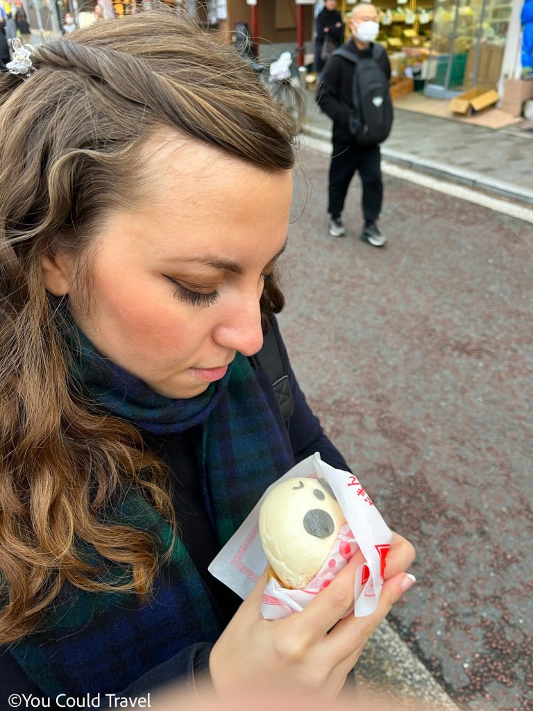 Cory from You Could Travel enjoying her panda steamed bun in Yokohama