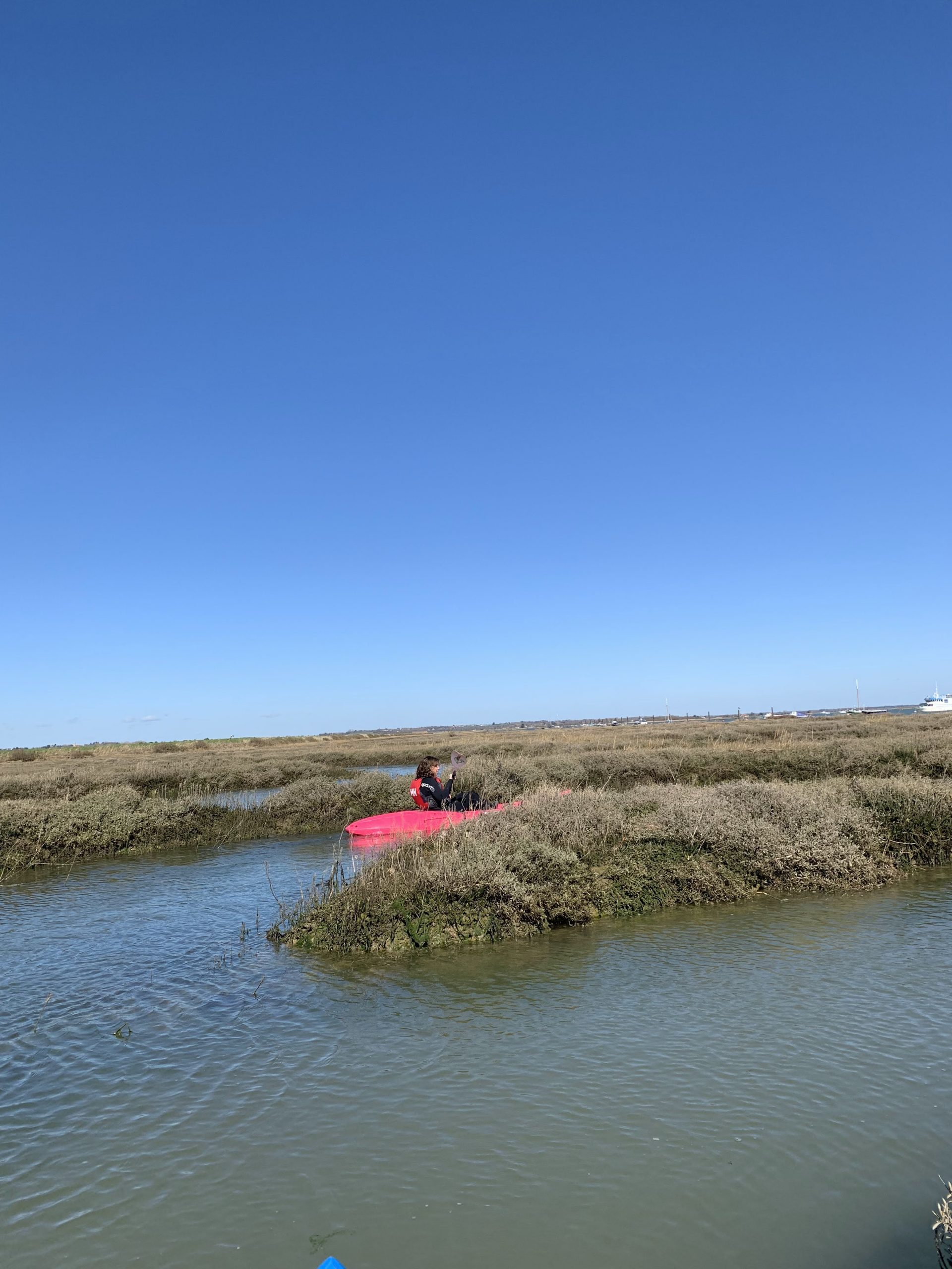 Cory kayaking in the quiet marshes
