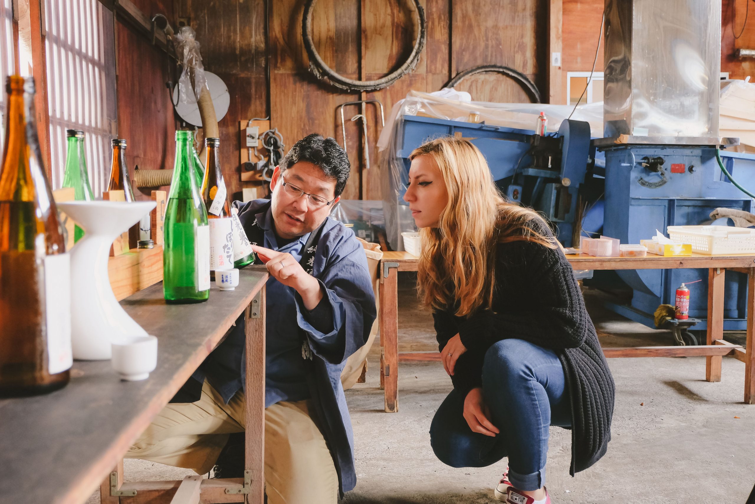 Must try in Japan: Cory visiting a local sake brewery and taking to the owner about how sake is produced