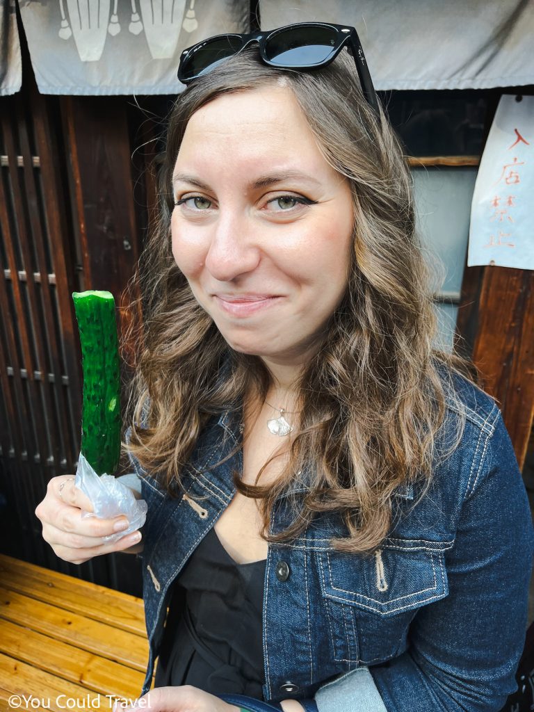 Cory eating a cucumber on a stick in Kawagoe