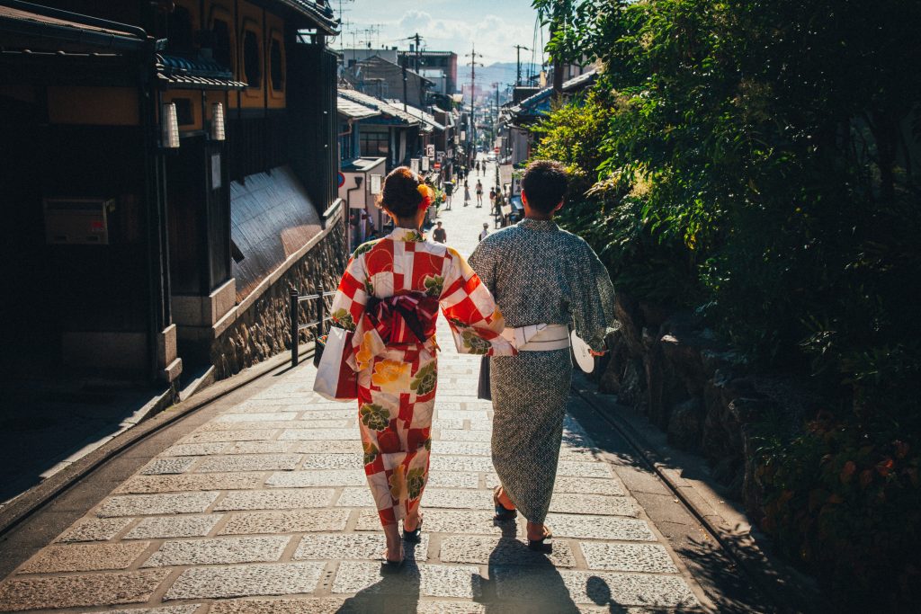 Couple dressed in yukata, walking in Japan