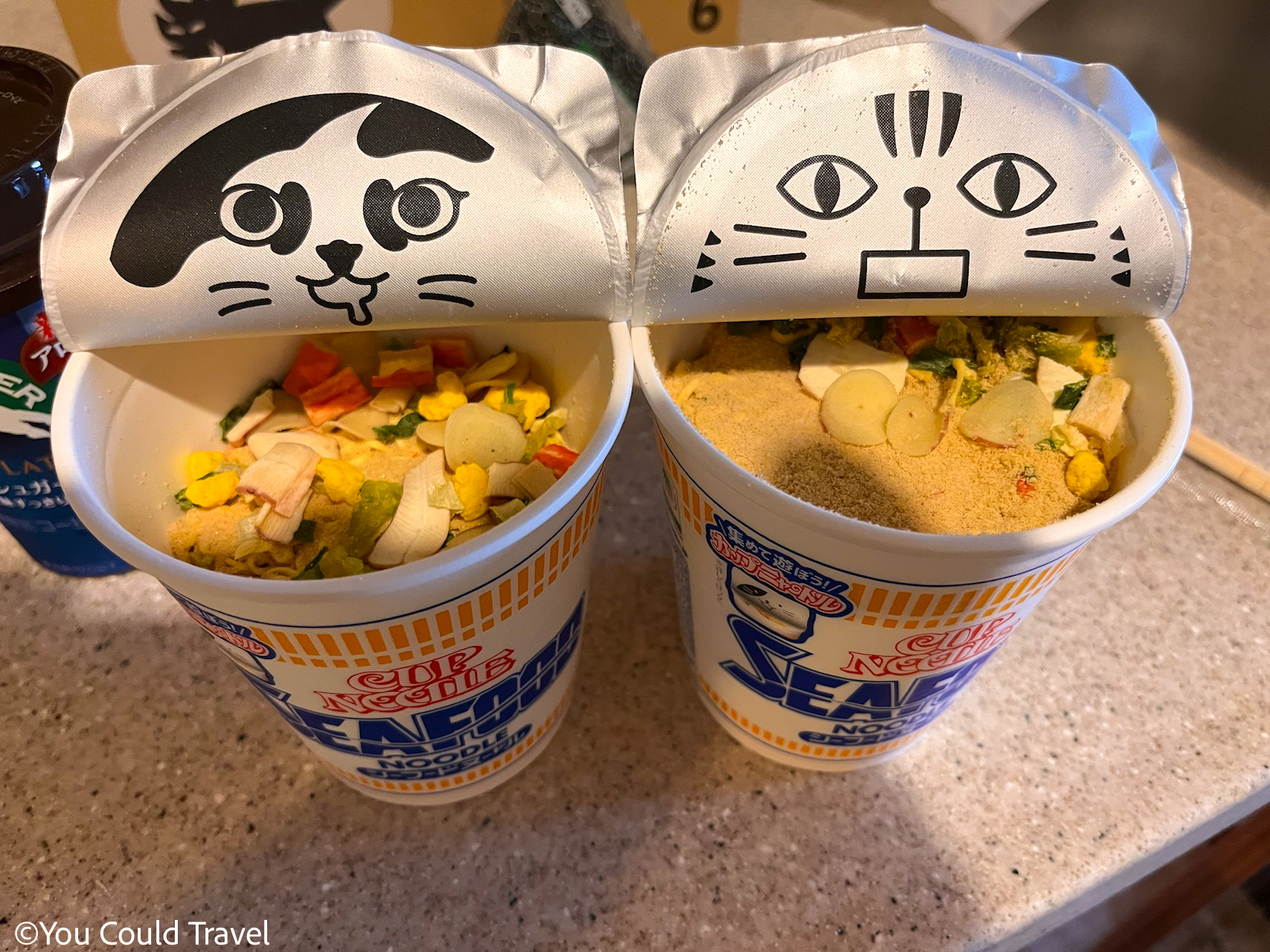 Cup noodle with seafood flavour and cute cats on the lid Cup noodle with seafood flavour and cute cats on the lid