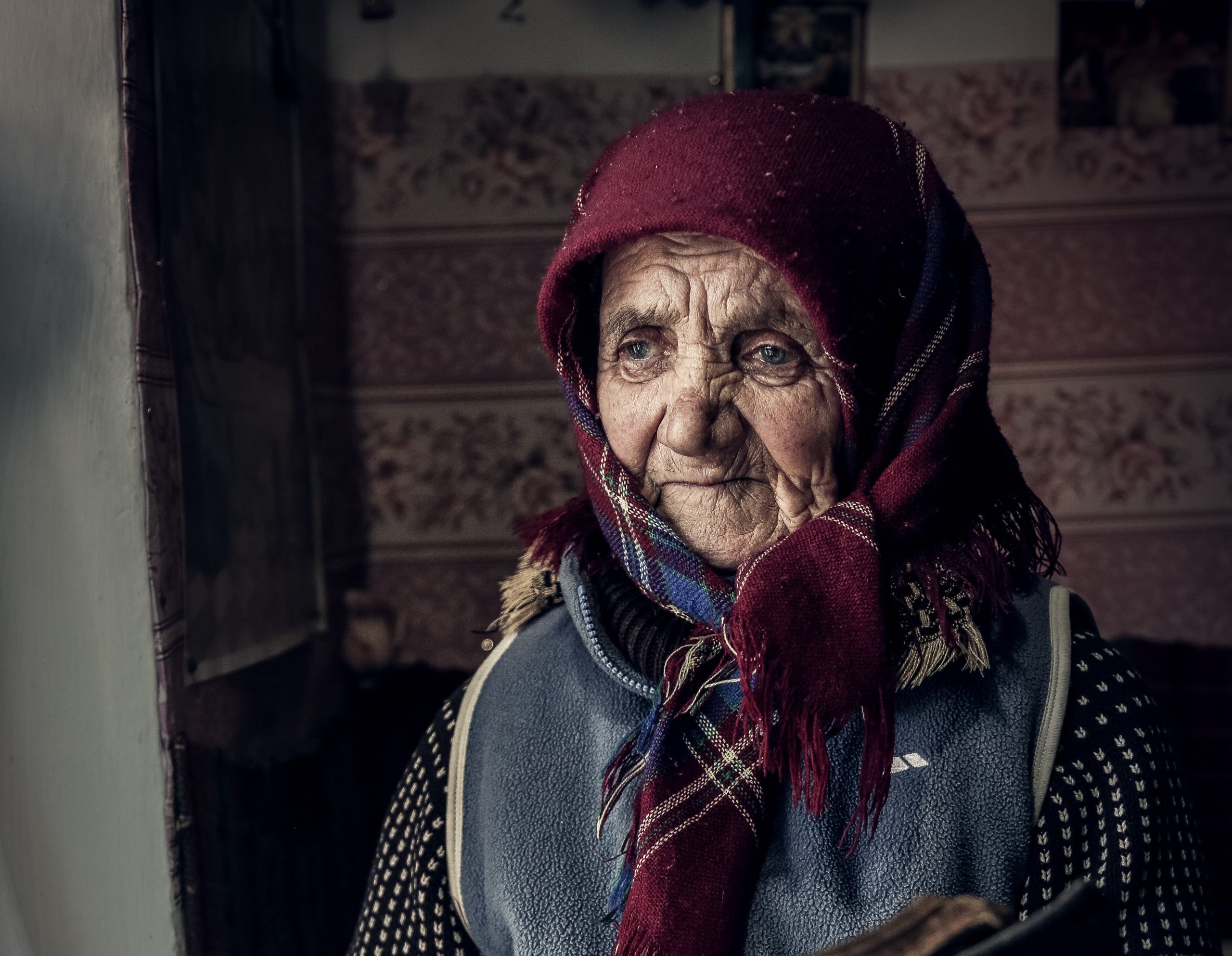 Decorative Romanian head scarf on an old Romanian lady