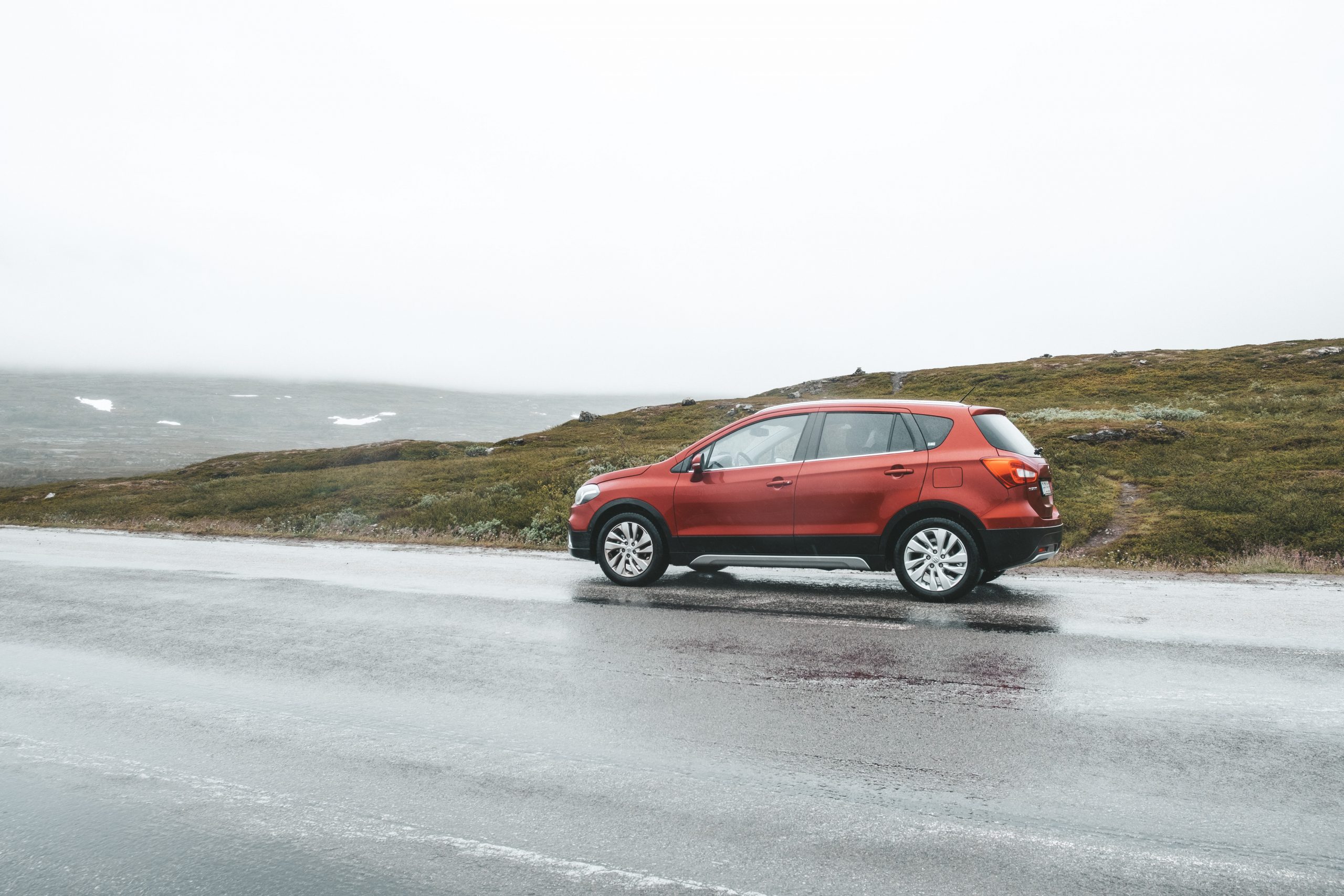 Entering Norway with the red Suzuki car