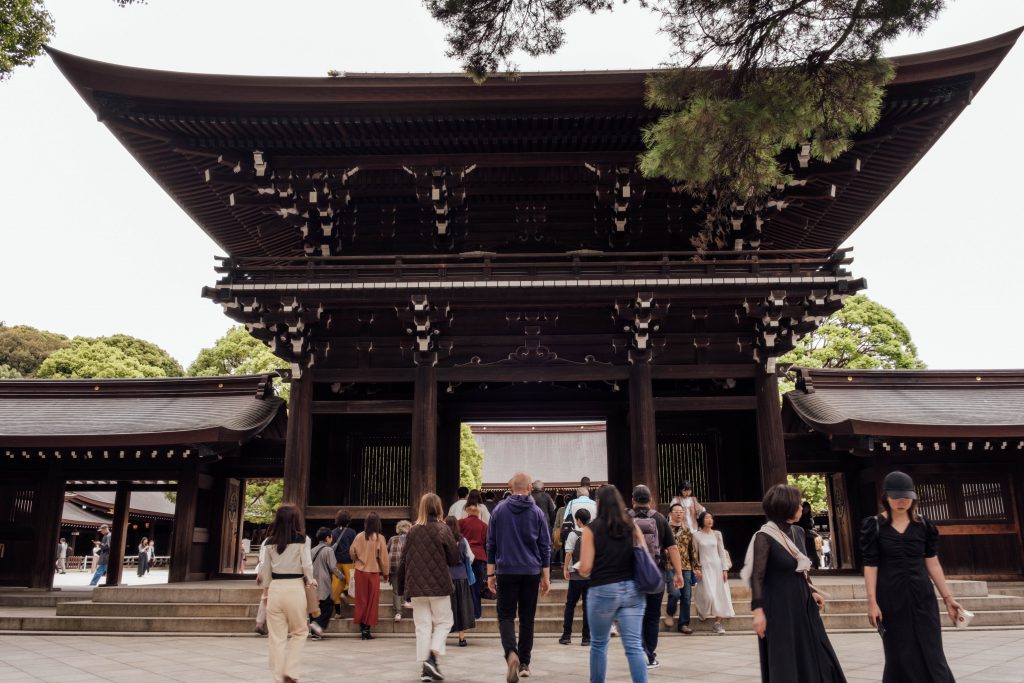 A large wooden entrance arch to the main Meiji shrine