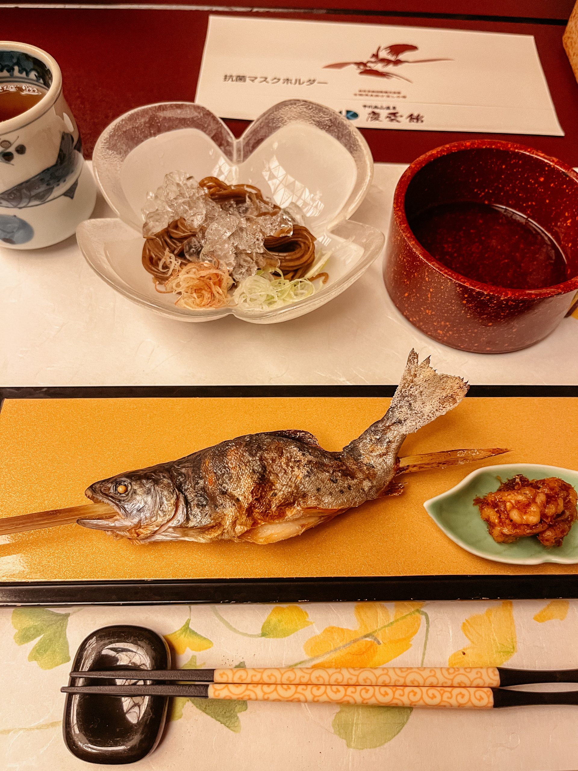Fish served on a plate with cold soba