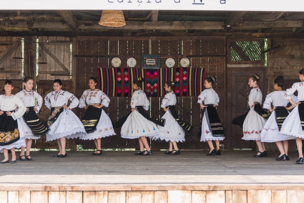 Folk dance in Romania with traditional clothes