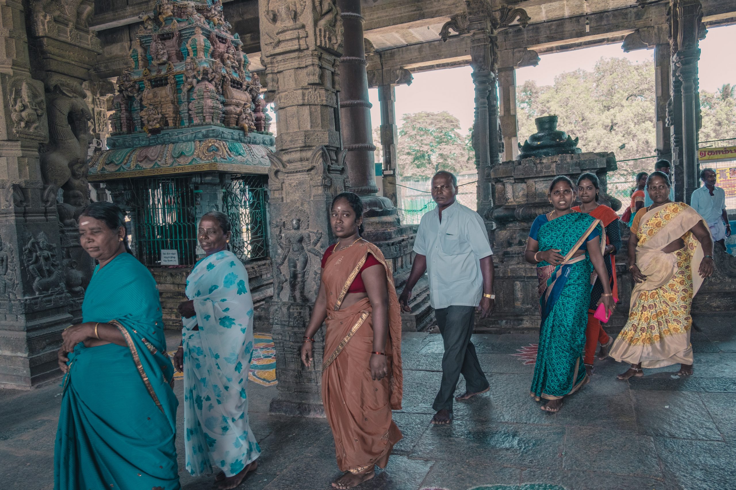 Indian women wearing traditional sari in a temple in Chennai