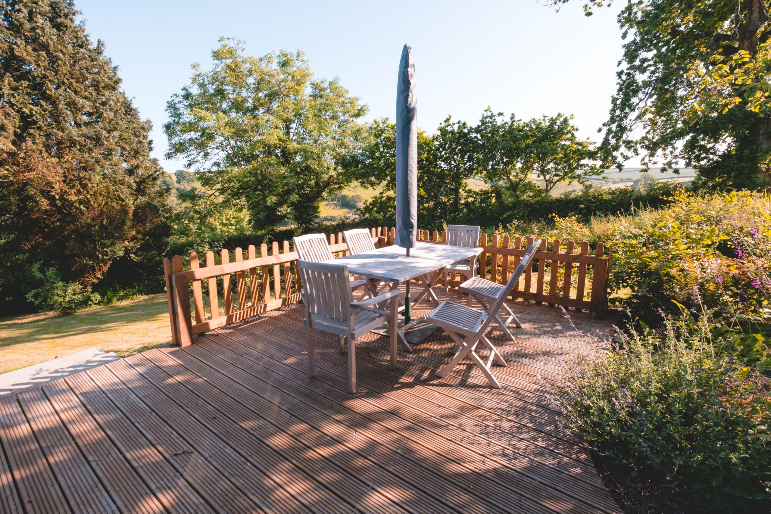 Inviting decking area to sit outside with coffee in Devon Inviting decking area to sit outside with coffee in Devon