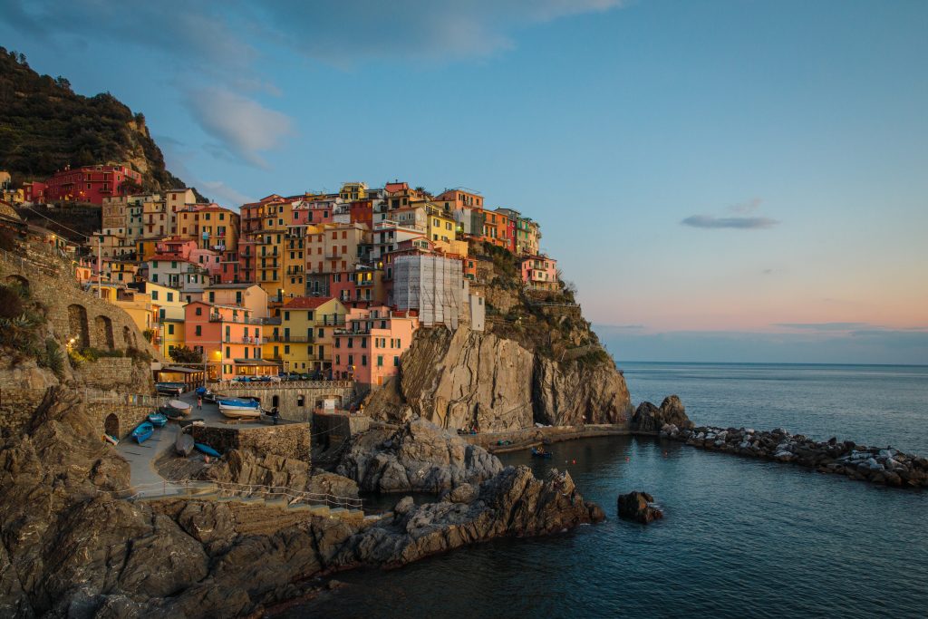 Italy Honeymoon Ideas - a romantic evening photo of an Italian coastal city