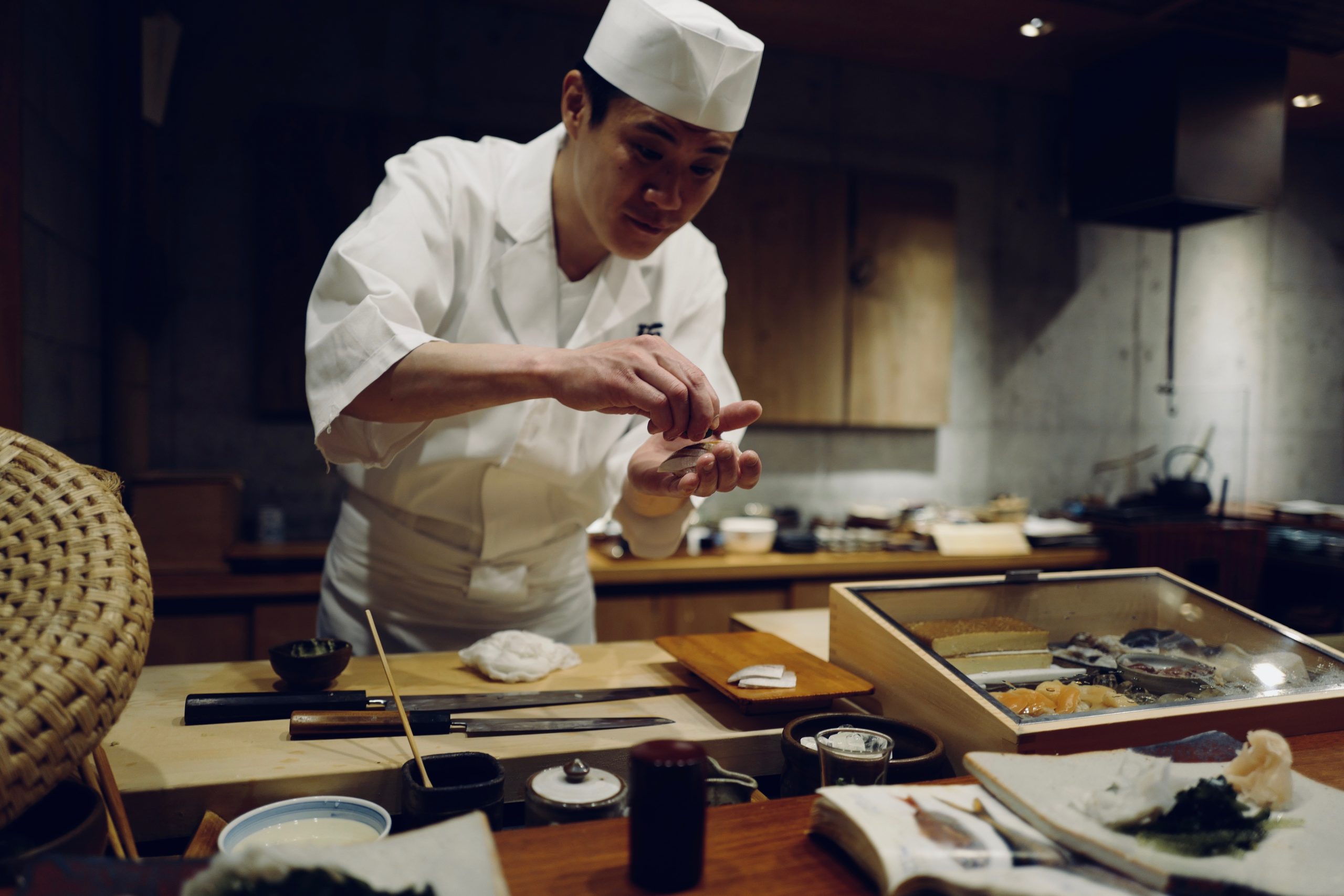 Japanese chef arranging his food to perfection