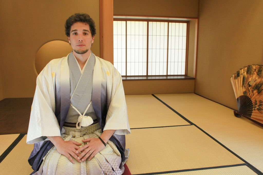 Greg from You Could Travel wearing a traditional Japanese kimono - he is dressed in a silk samurai attire 