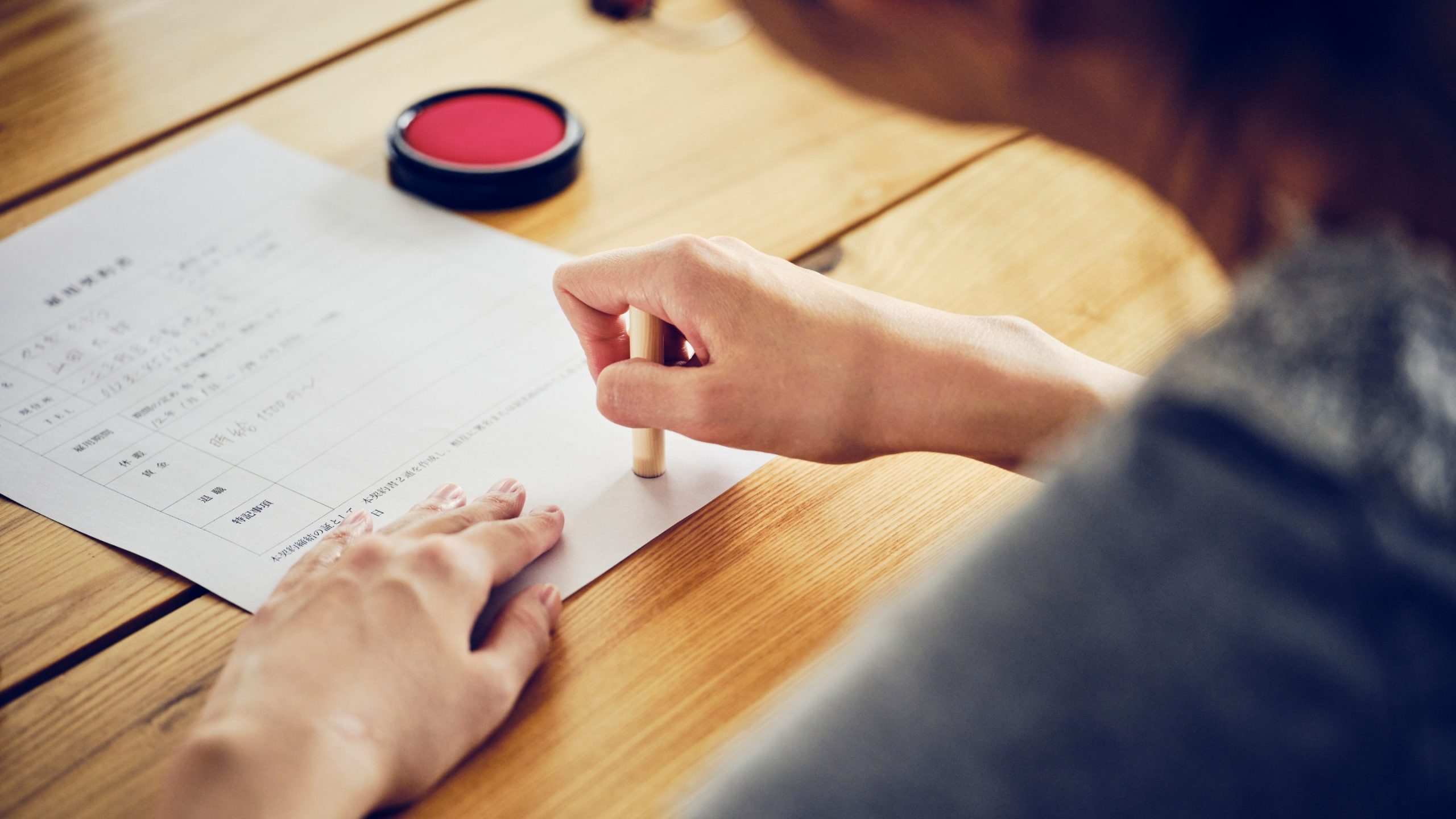 Japanese person using Hanko for their official documents