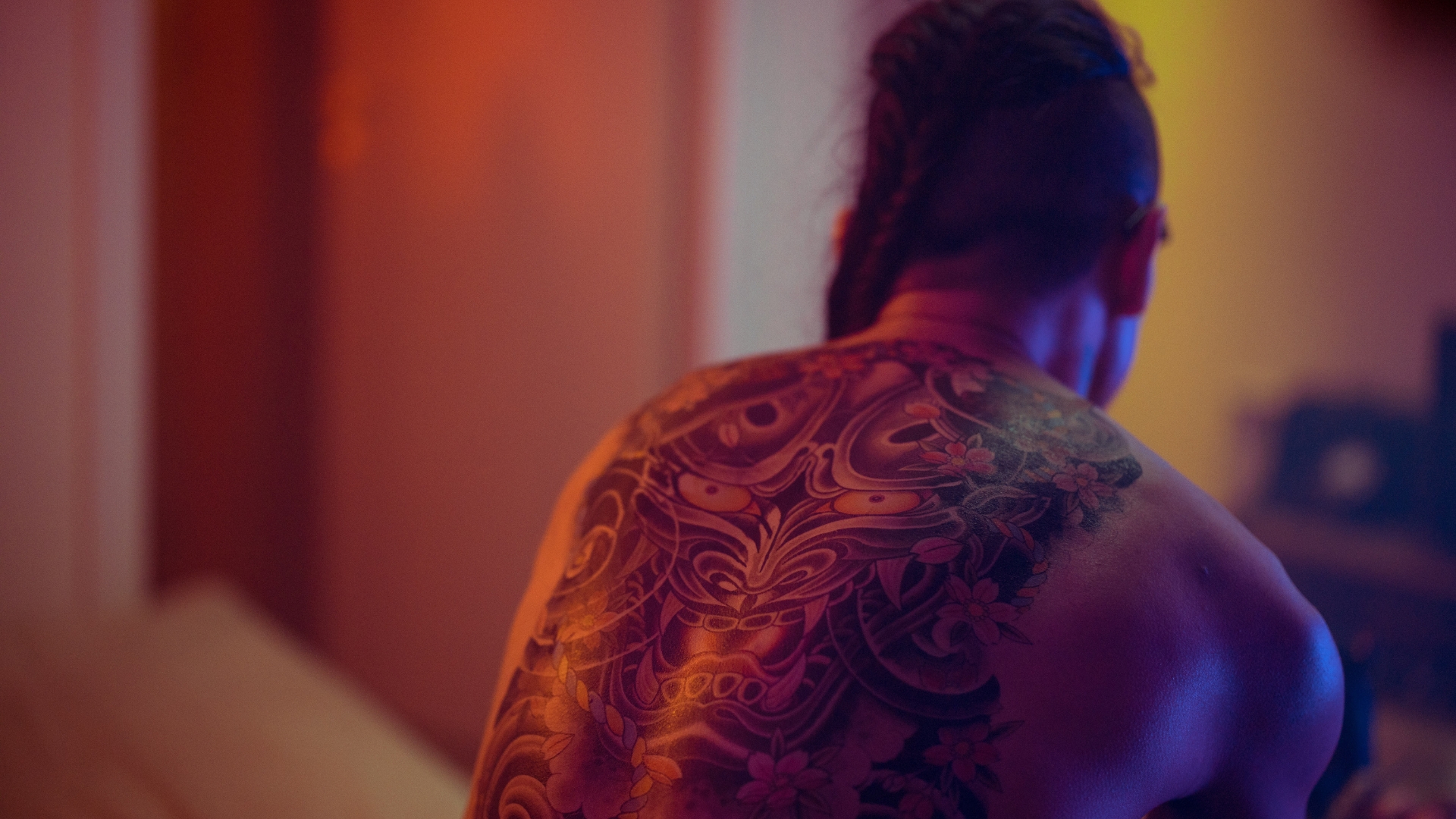 Japanese person with a large tattoo on their back