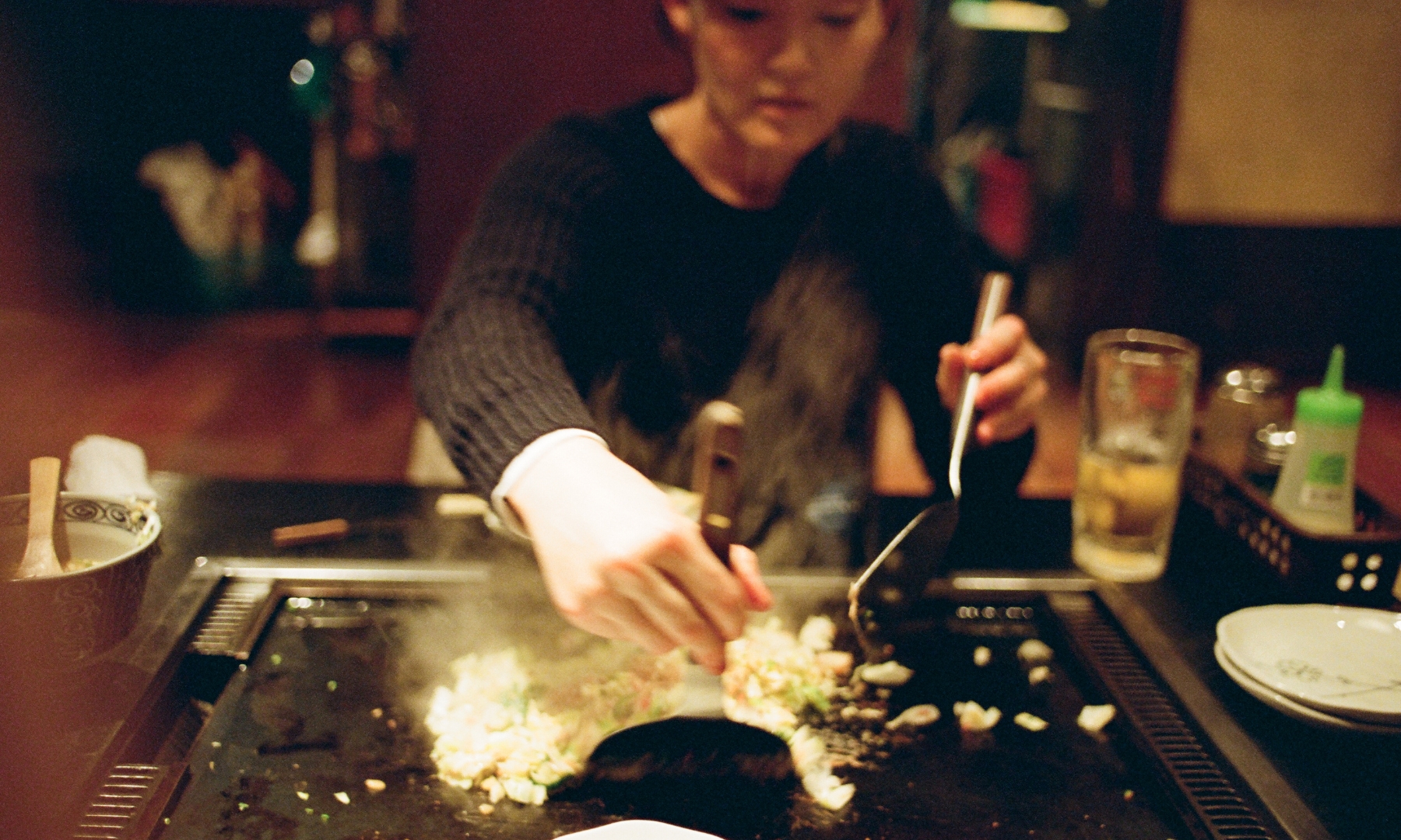 Japanese woman cooking Monjayaki Tsukishima Monja Dori Japanese woman cooking Monjayaki Tsukishima Monja Dori