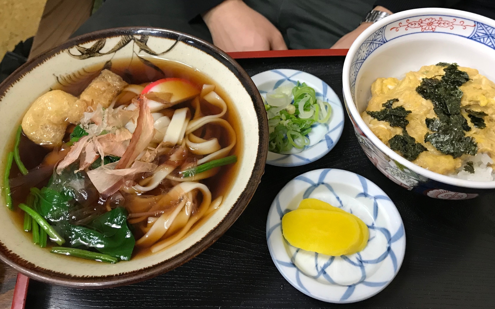 A bowl of kishimen, a flat udon noodle served in a clear broth