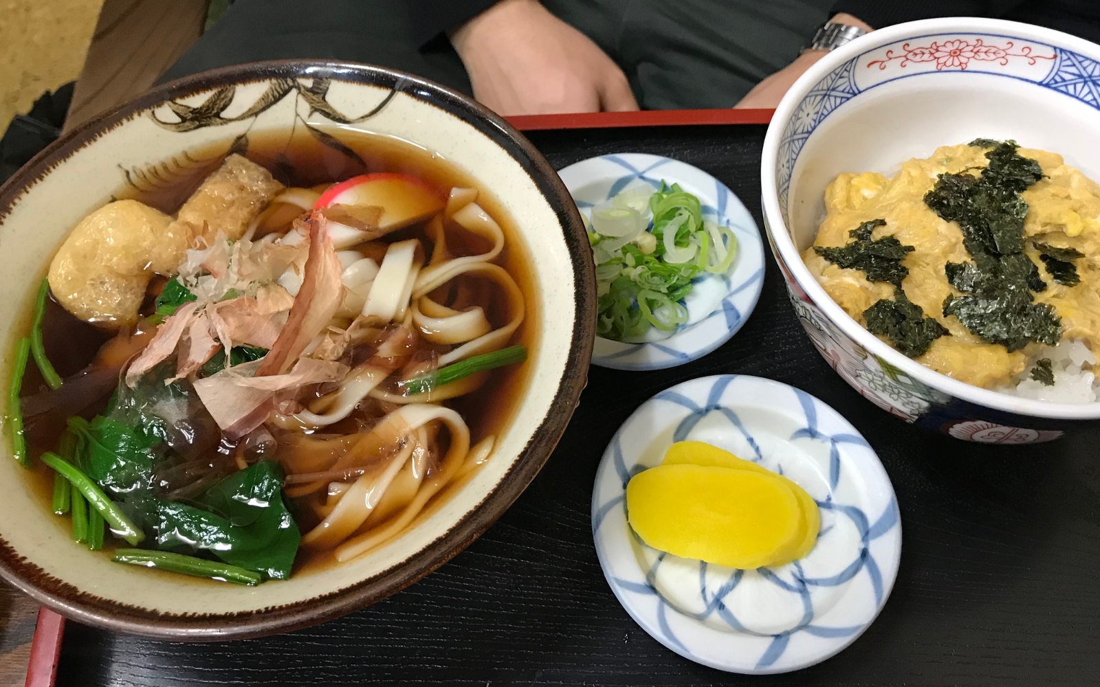 A bowl of kishimen, a flat udon noodle served in a clear broth A bowl of kishimen, a flat udon noodle served in a clear broth