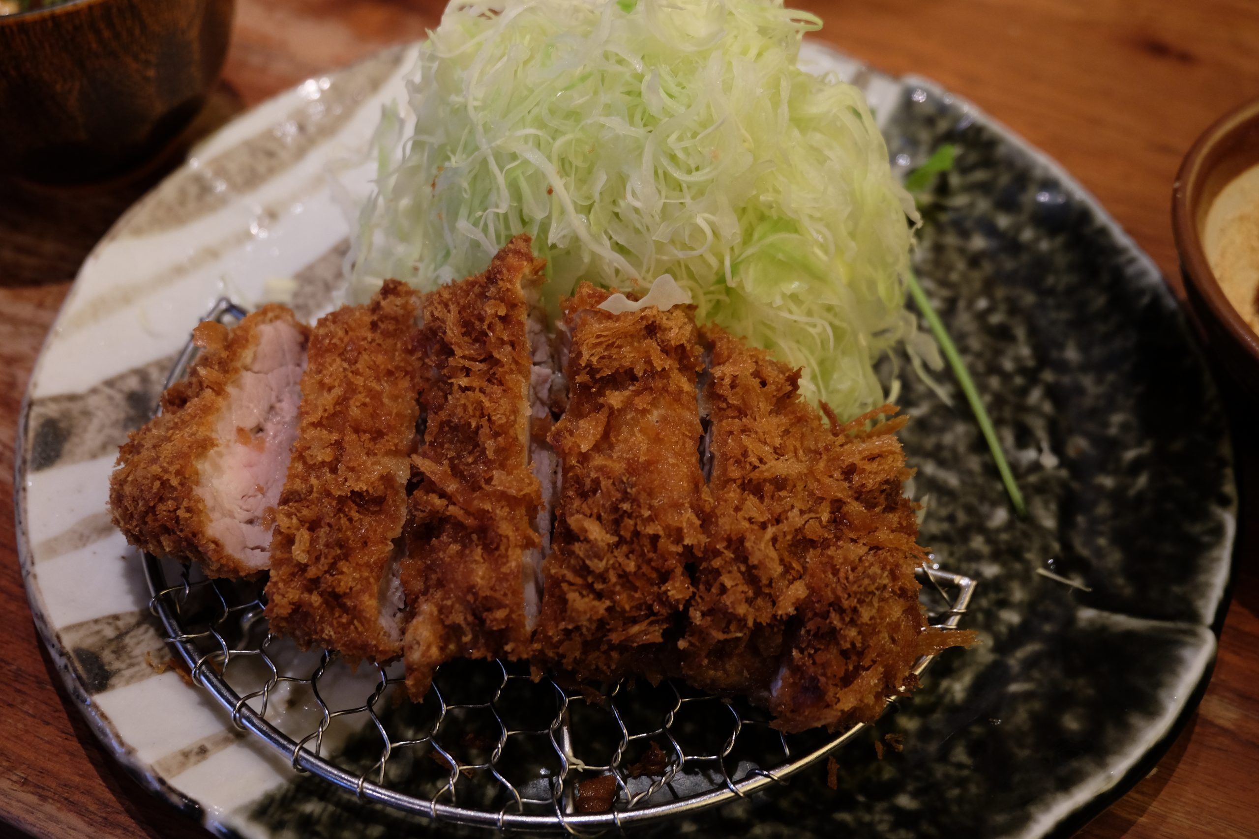 Traditional pork tonkatsu served with miso, rice and shredded cabbage