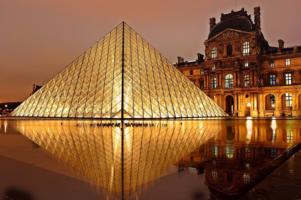 Louvre museum at night. Best place to stay in Paris for sightseeing