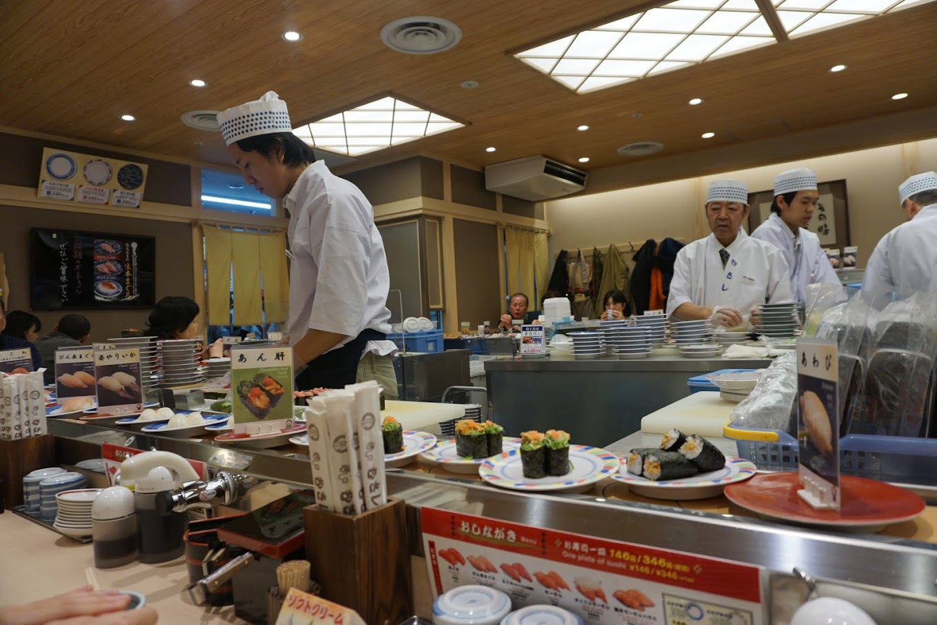 Staff making fresh sushi in Musashi Sushi in Kyoto