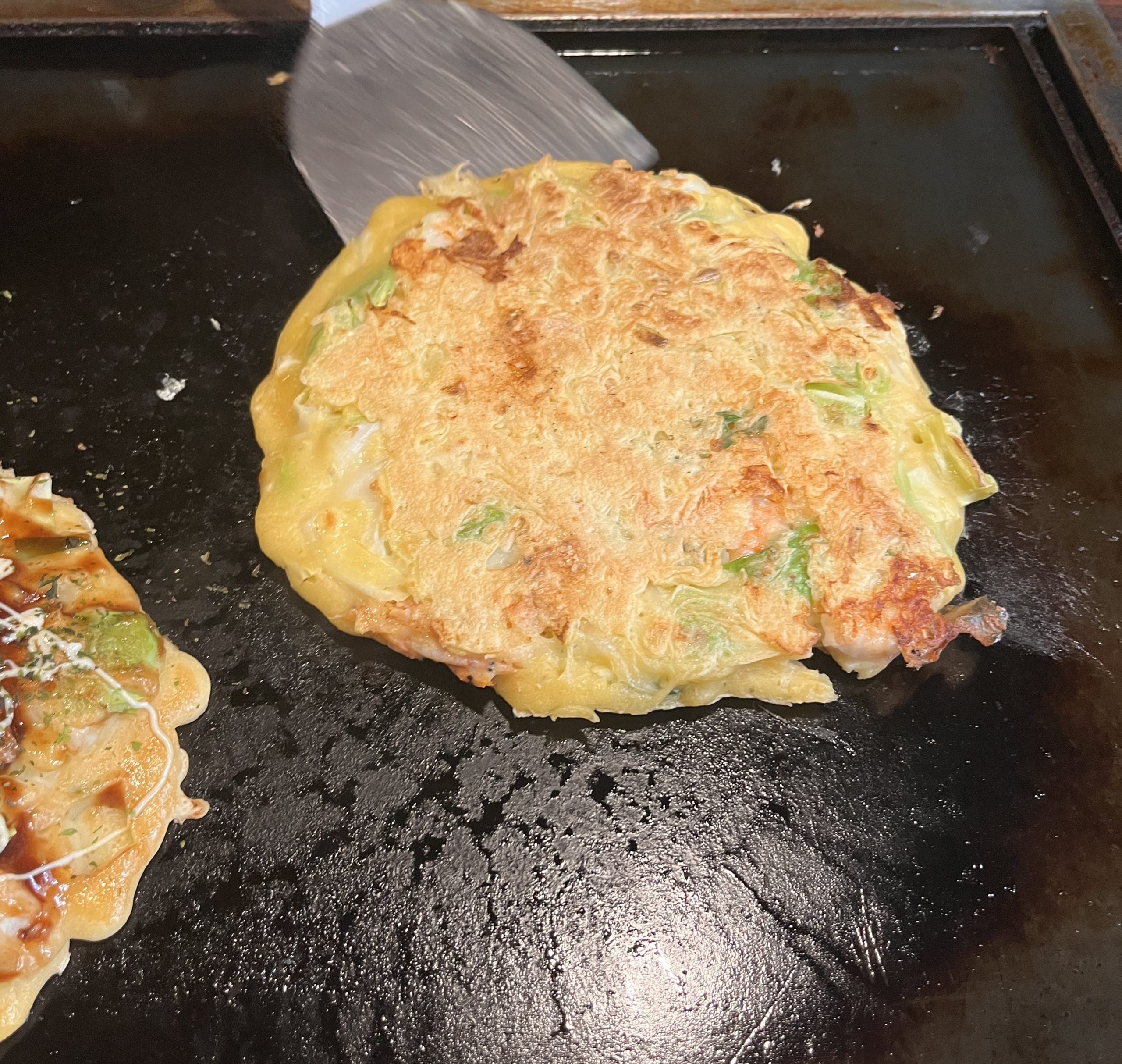 Making okonomiyaki in Sometaro Asakusa restaurant