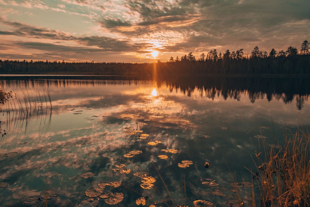 Midnight sun over a beautiful lake in Rovaniemi, Finland