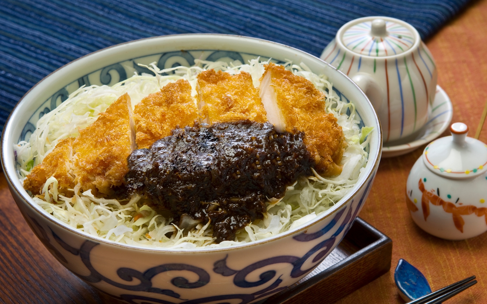 A plate of miso katsu, breaded pork with a sweet and savoury miso sauce