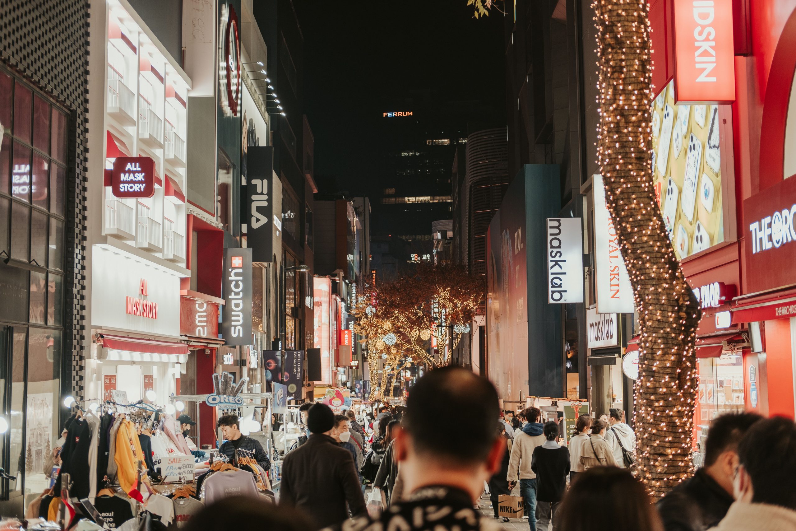 Myeongdong district at night - one of the best places to stay in Seoul