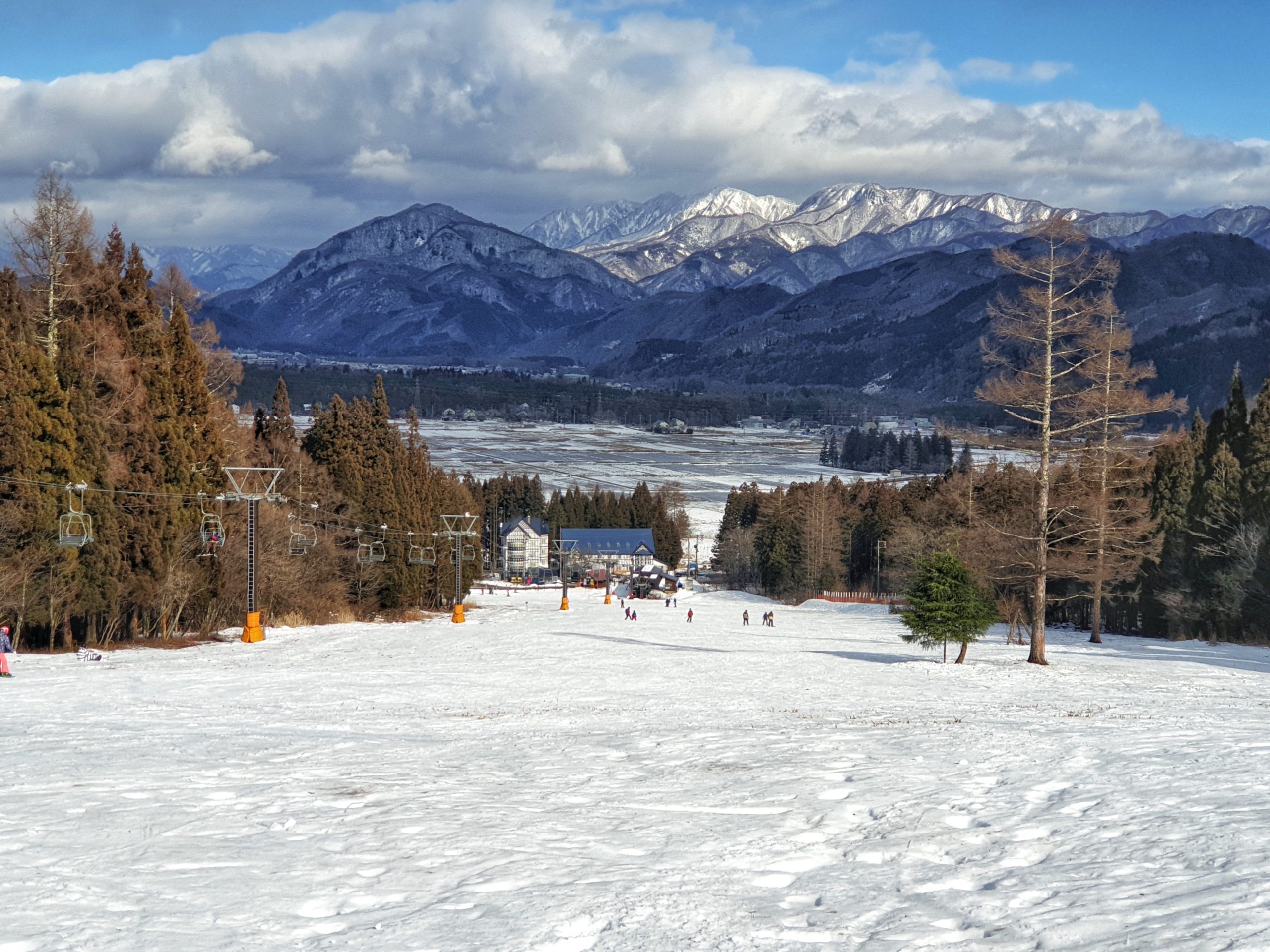 Nagano under snow with mountains in the background