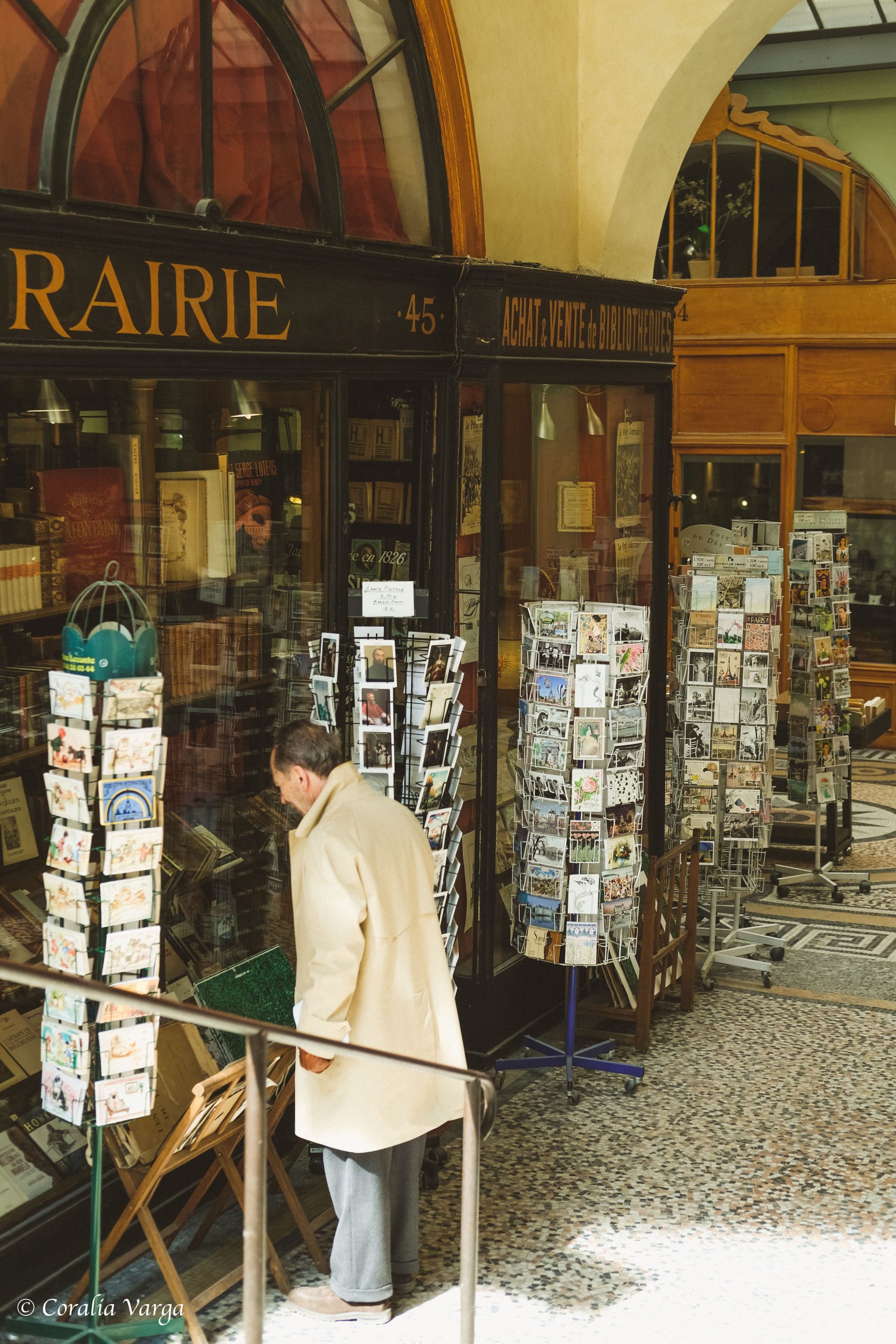 Old man searching for books in galleries in Paris