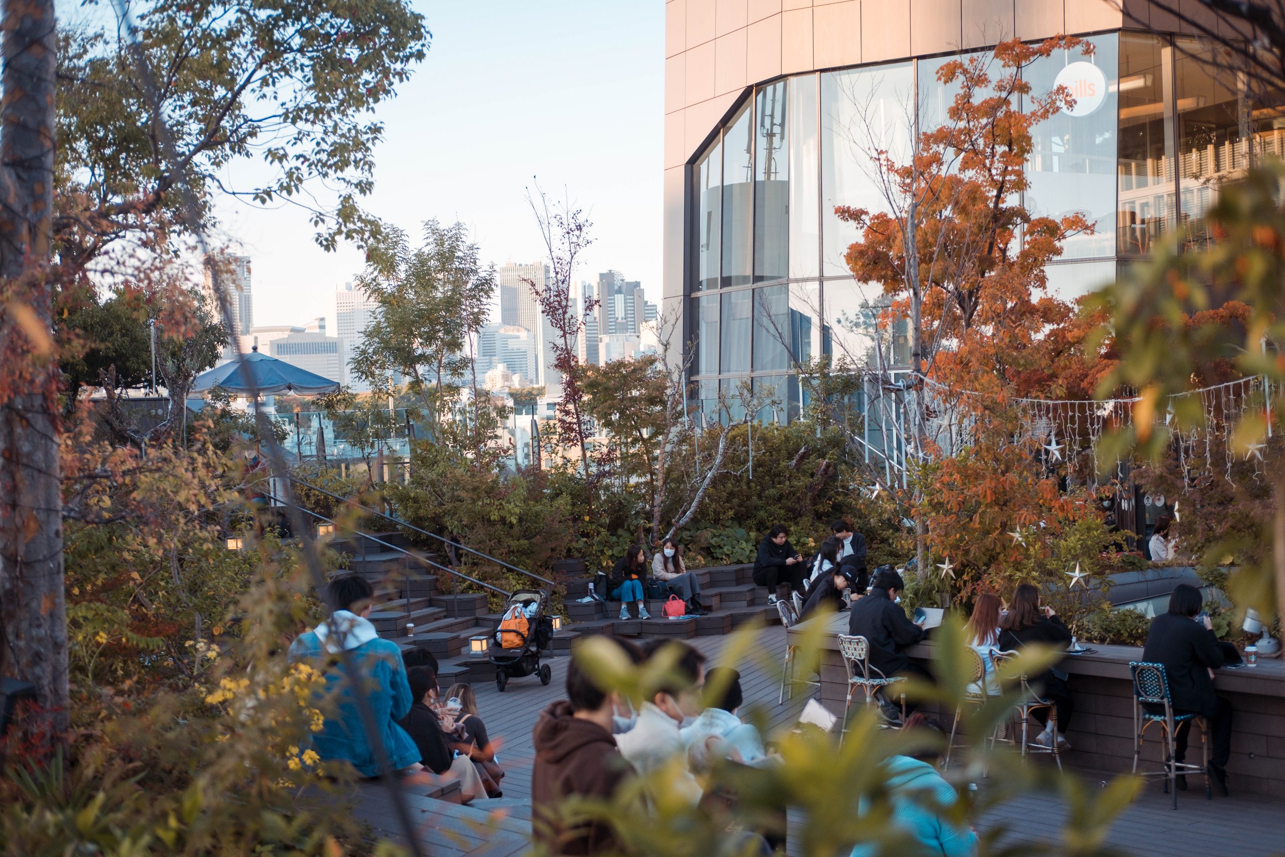 People relaxing in Omohara forest Tokyu Plaza