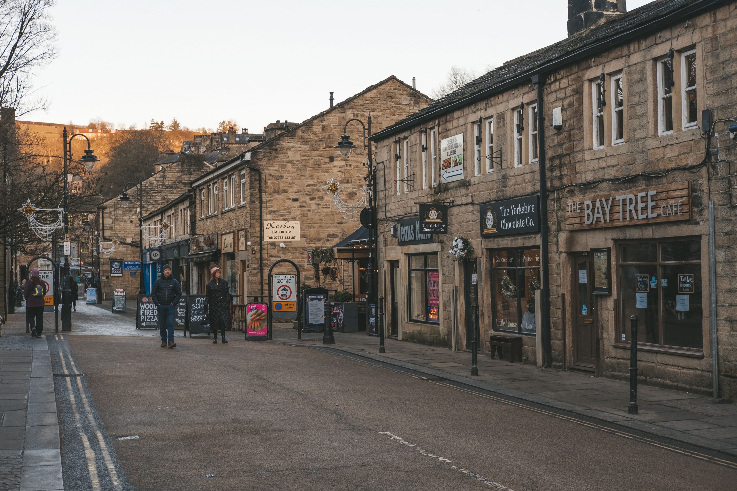 People walking and shopping in Hebden Bridge at the many indie boutiques