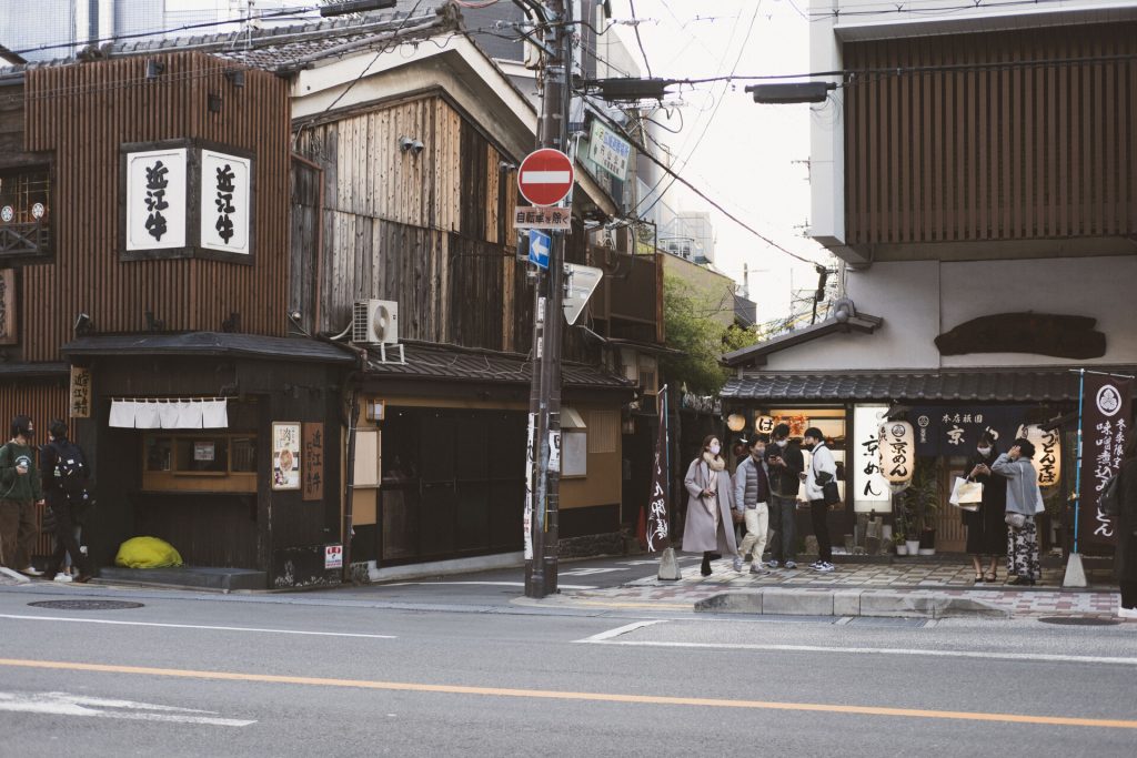 People walking and exploring Shijo Dori in Kyoto Japan